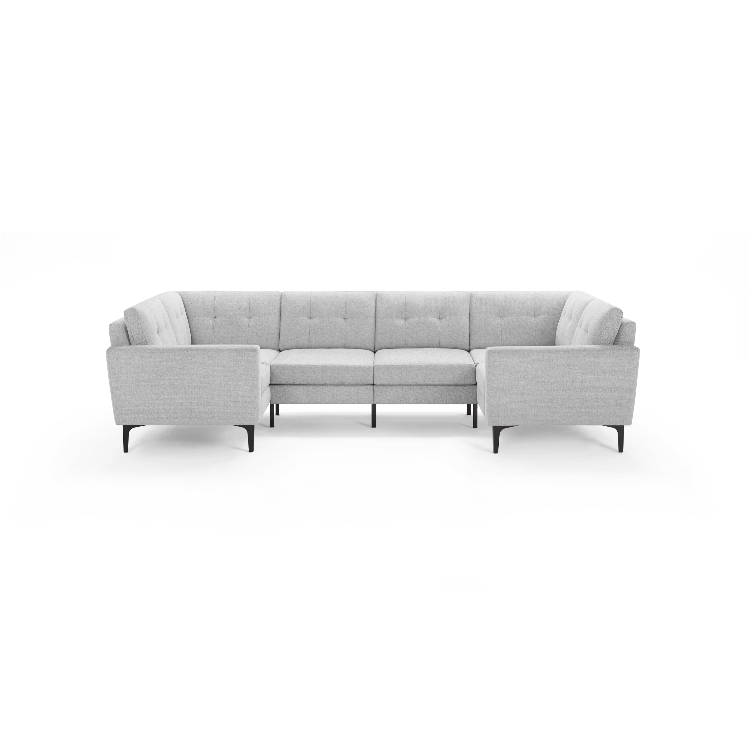 Light gray upholstered U-shaped sectional sofa with tufted back cushions and slim black metal legs, designed for modern living rooms.