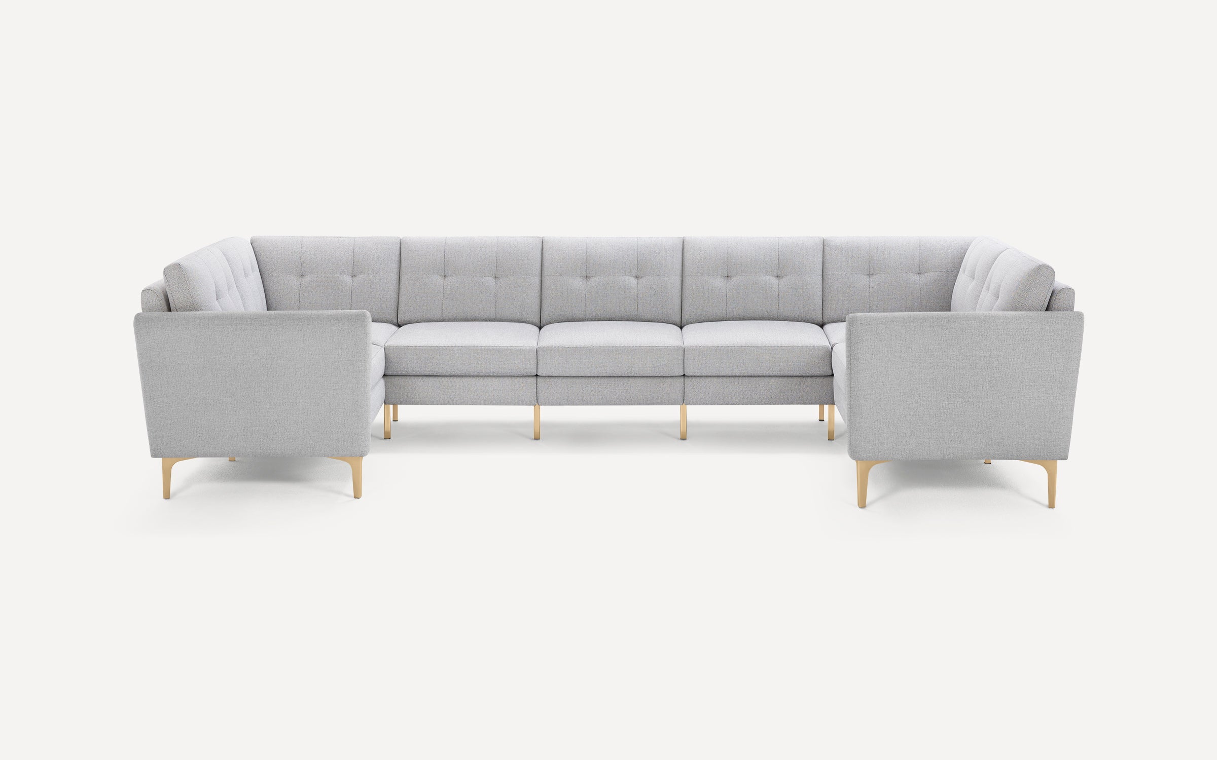 Light gray modern sectional sofa with tufted cushions and light wooden legs, arranged in a U-shape on a white background.