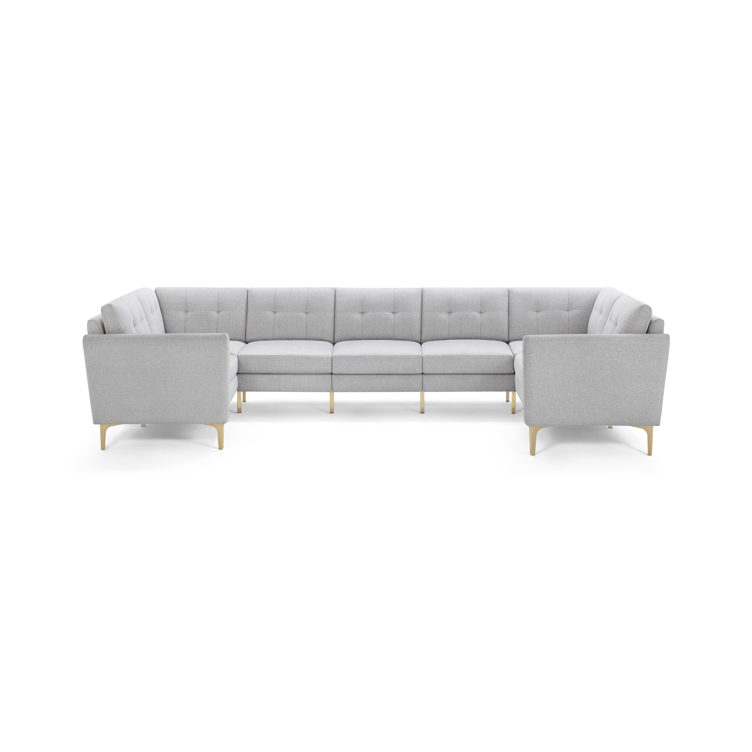 Light gray fabric U-shaped sectional sofa with tufted back cushions and light wooden legs, modern and spacious design.