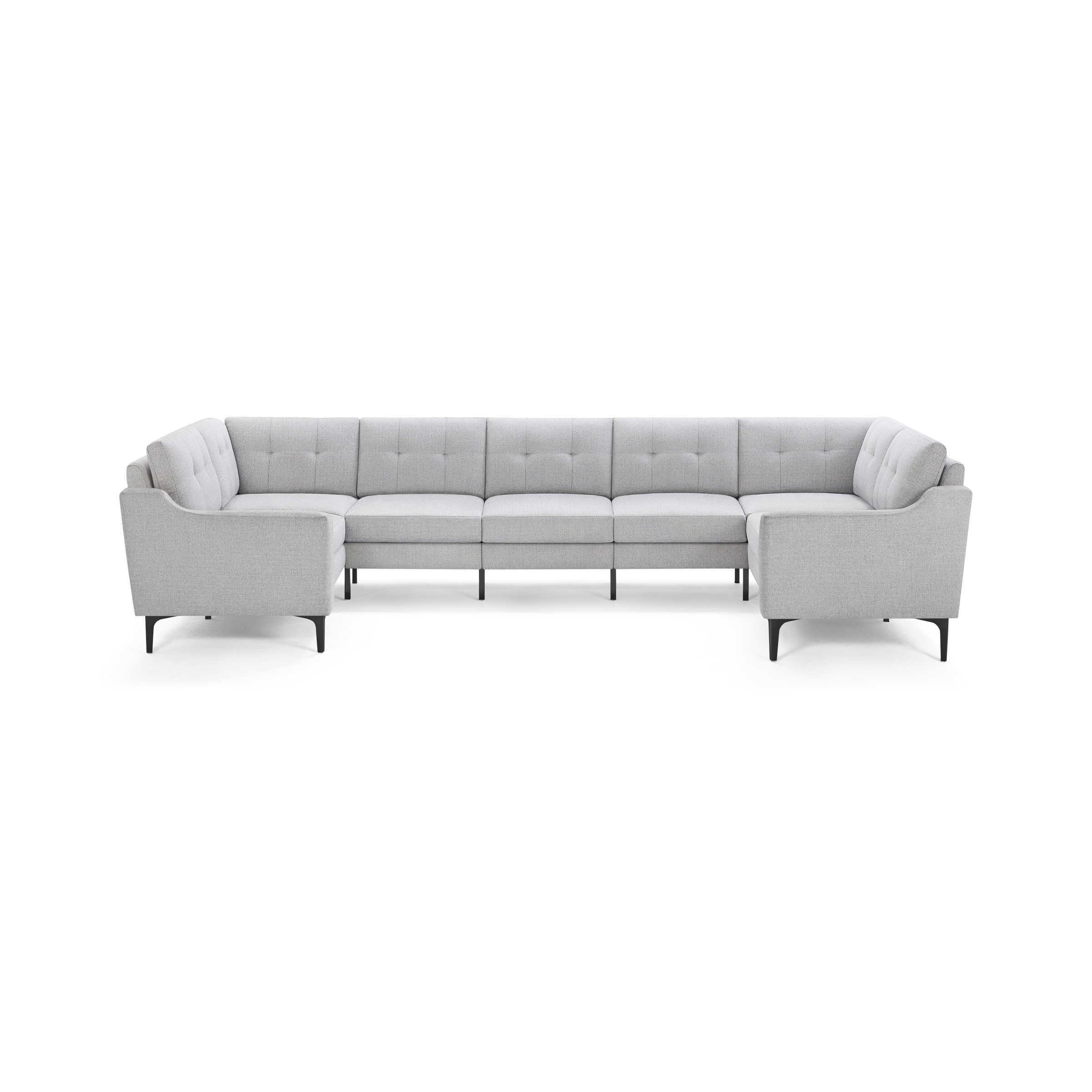 Light gray upholstered large U-shaped sectional sofa with tufted backs and slender black legs on a white background.
