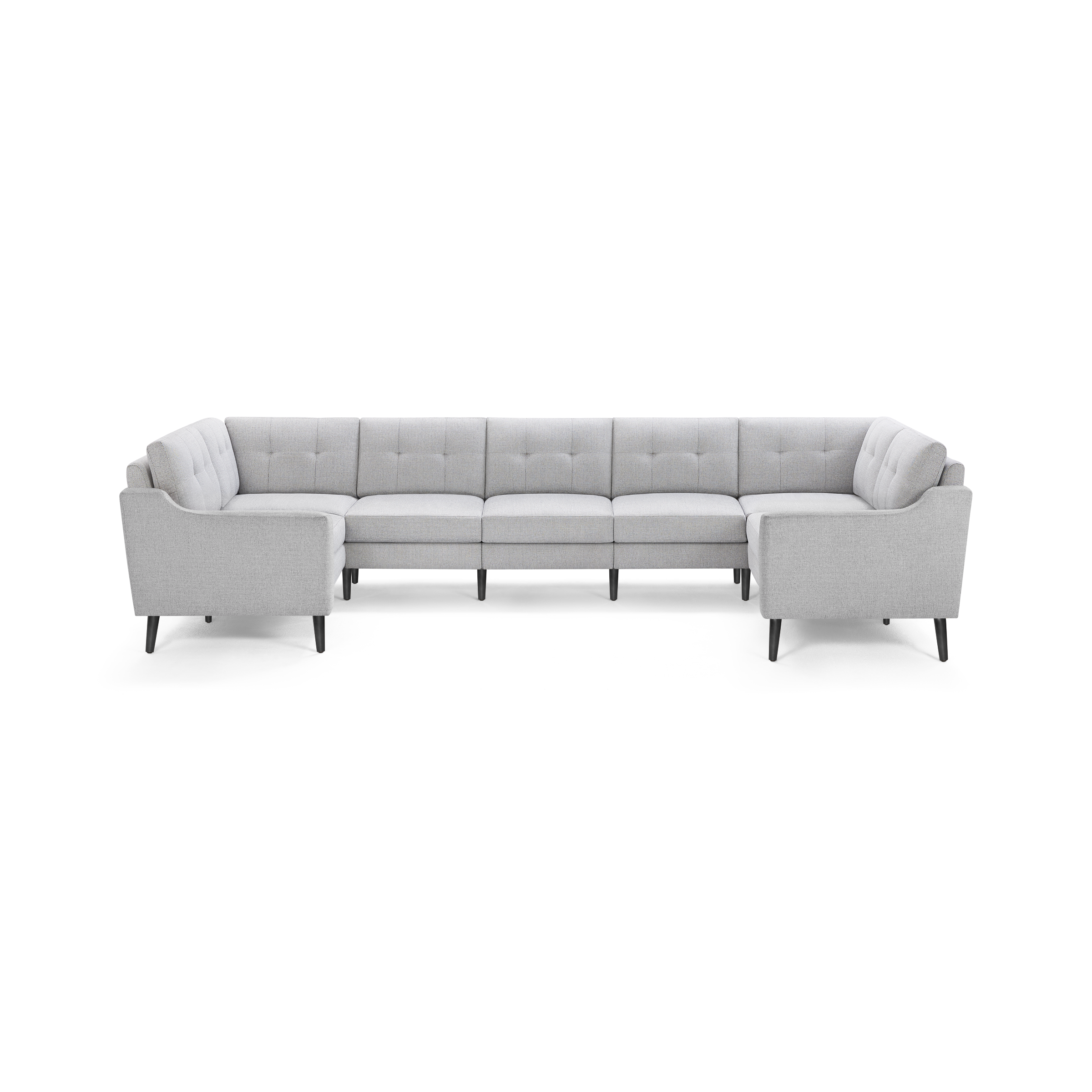 Light gray upholstered U-shaped sectional sofa with tufted back cushions and angled black legs, providing modern and spacious seating.