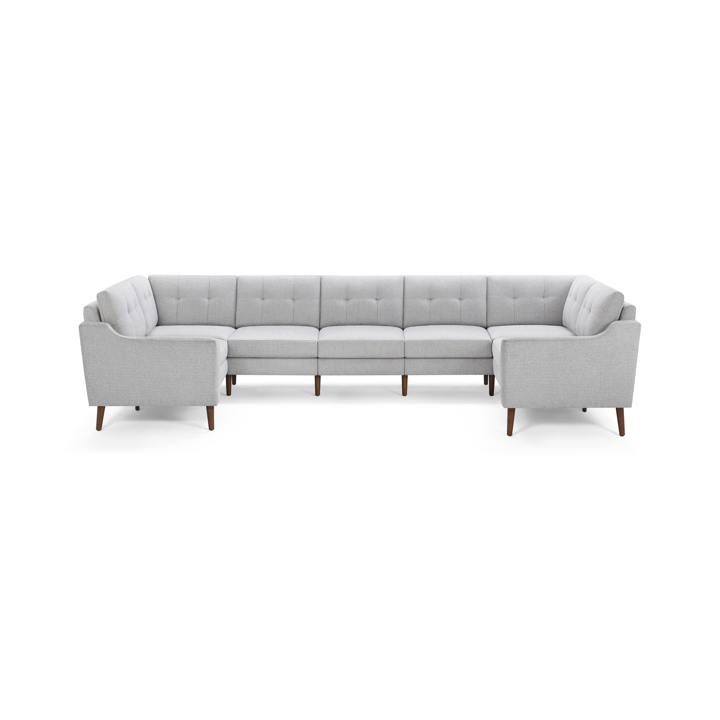 Light gray upholstered U-shaped sectional sofa with tufted back cushions and wooden legs, designed for modern living rooms.