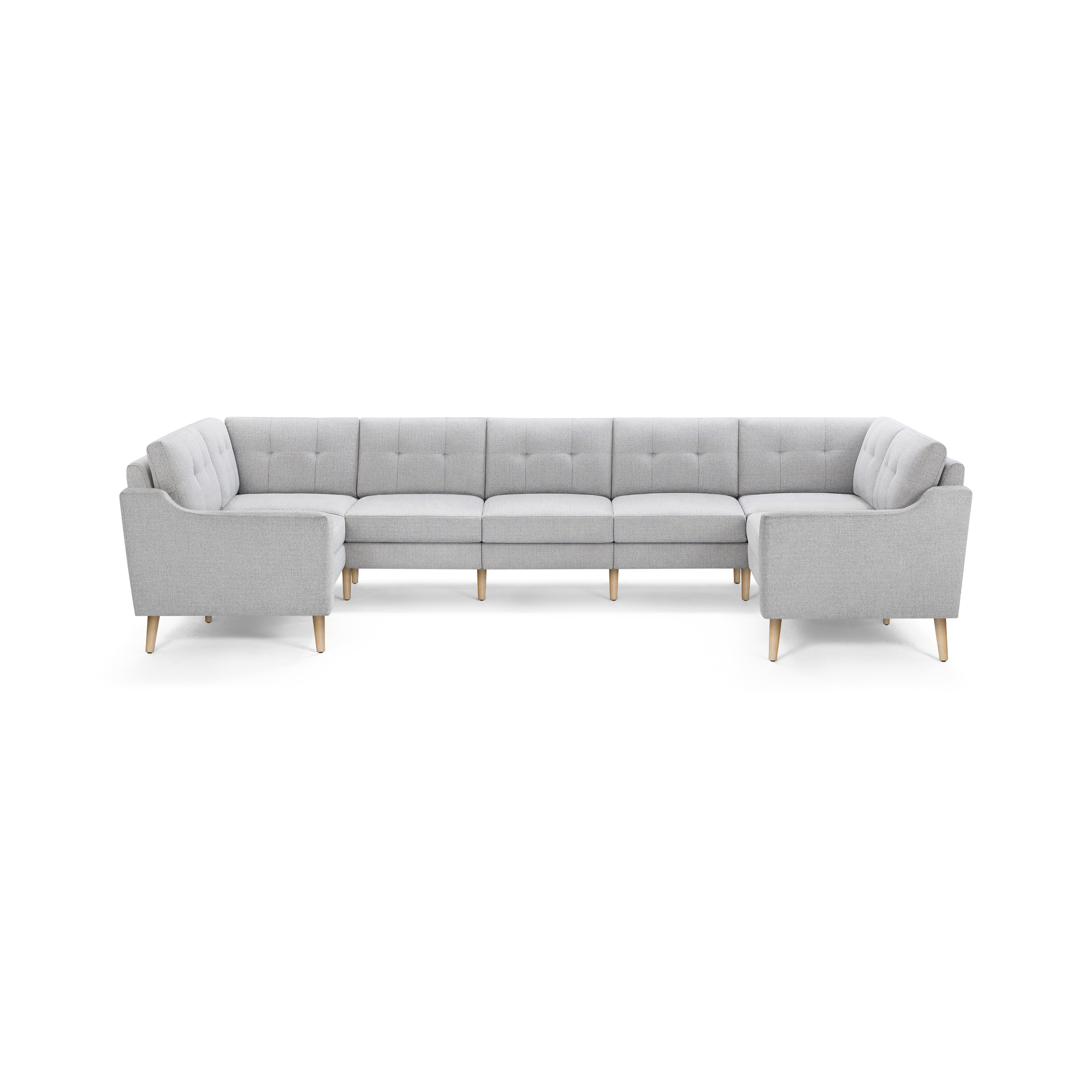 Light gray L-shaped sectional sofa with tufted cushions and wooden legs, modern and spacious for large living rooms.