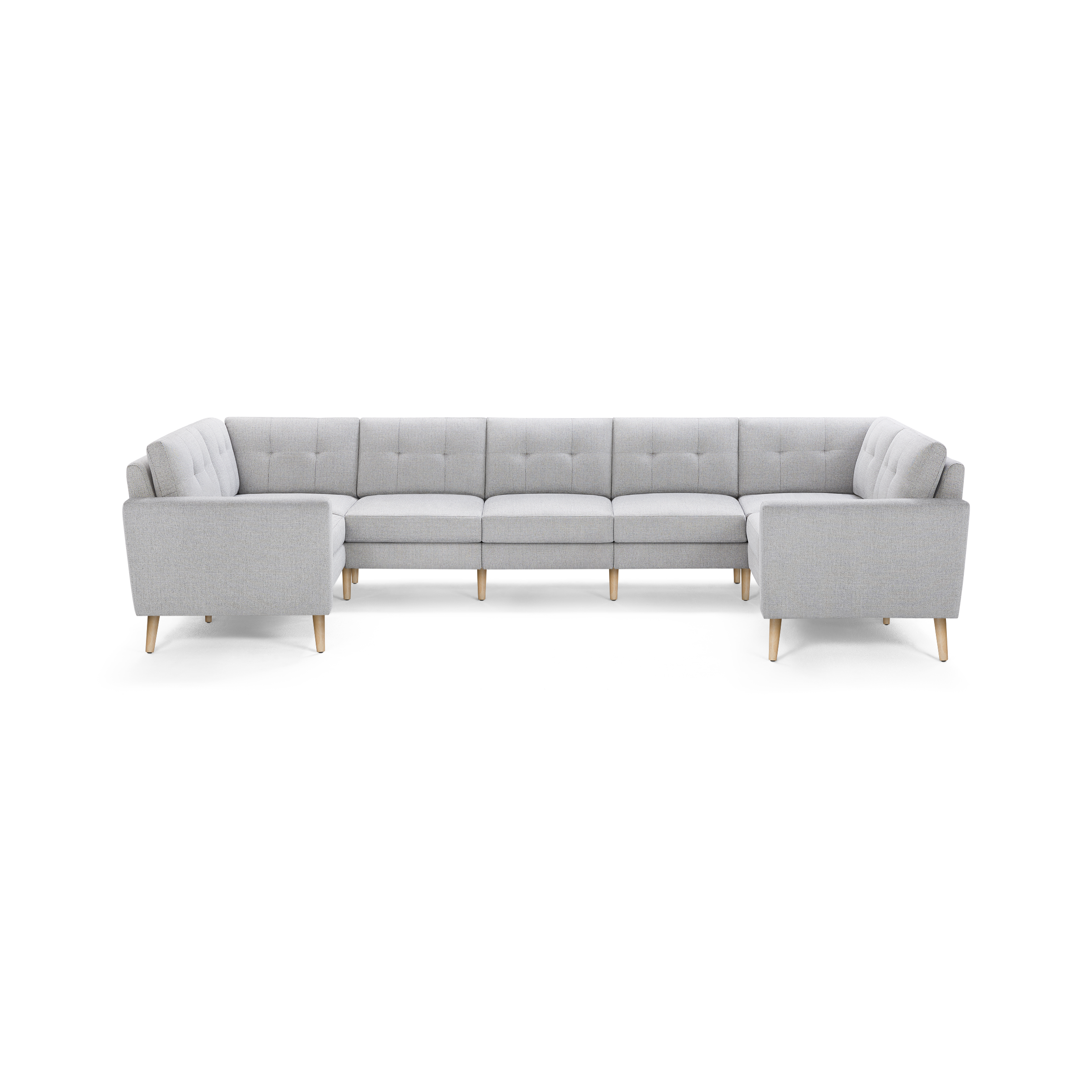 Light gray U-shaped sectional sofa with tufted cushions, straight armrests, and wooden legs, designed for spacious seating.