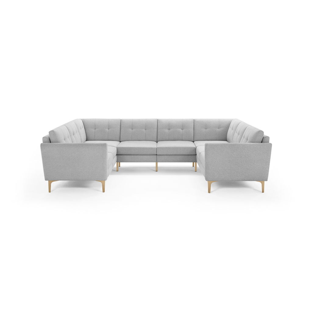Light gray modern U-shaped sectional sofa with tufted cushions and wooden legs, designed for spacious seating and comfort.
