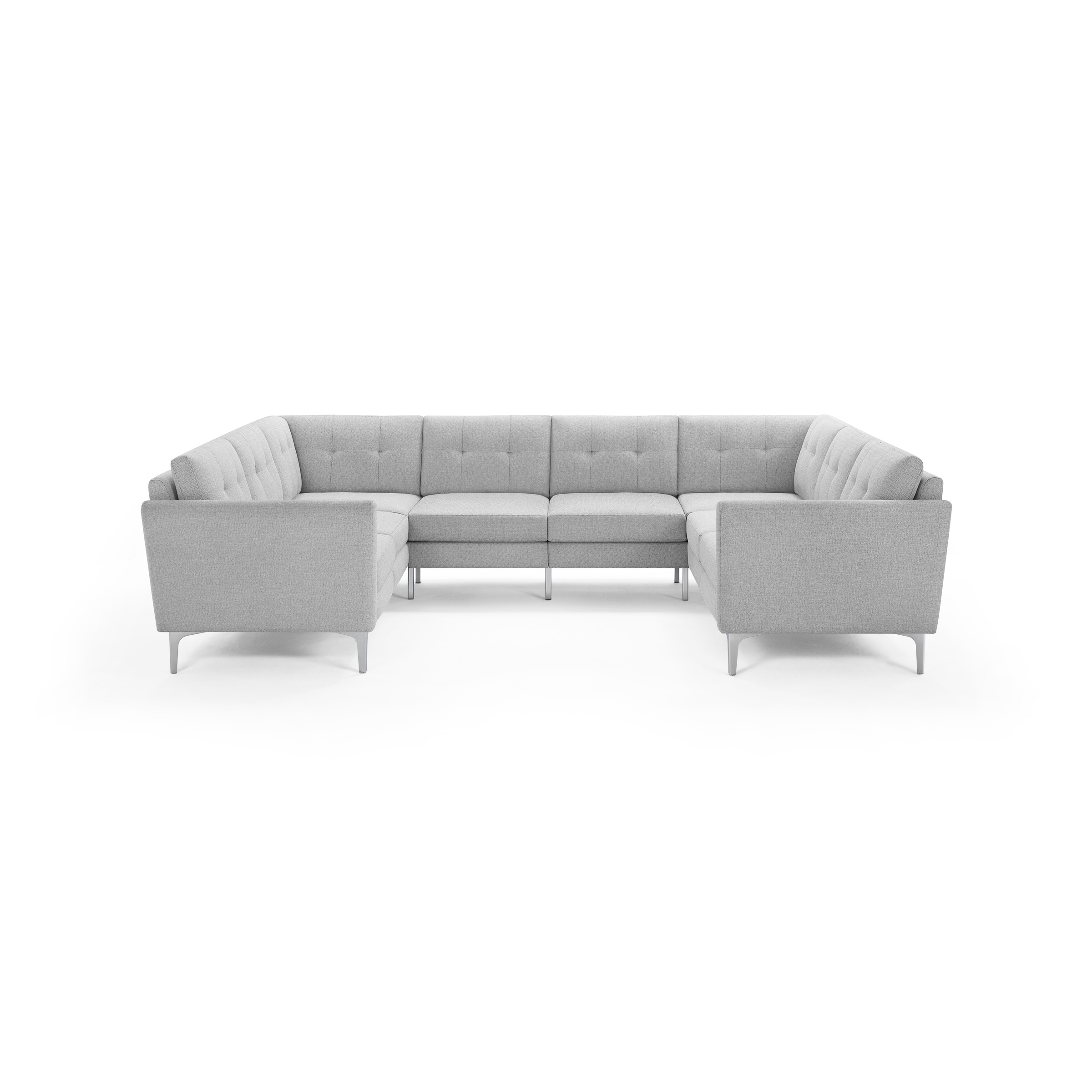 Light gray fabric U-shaped sectional sofa with tufted back cushions and modern metal legs, set against a black background.