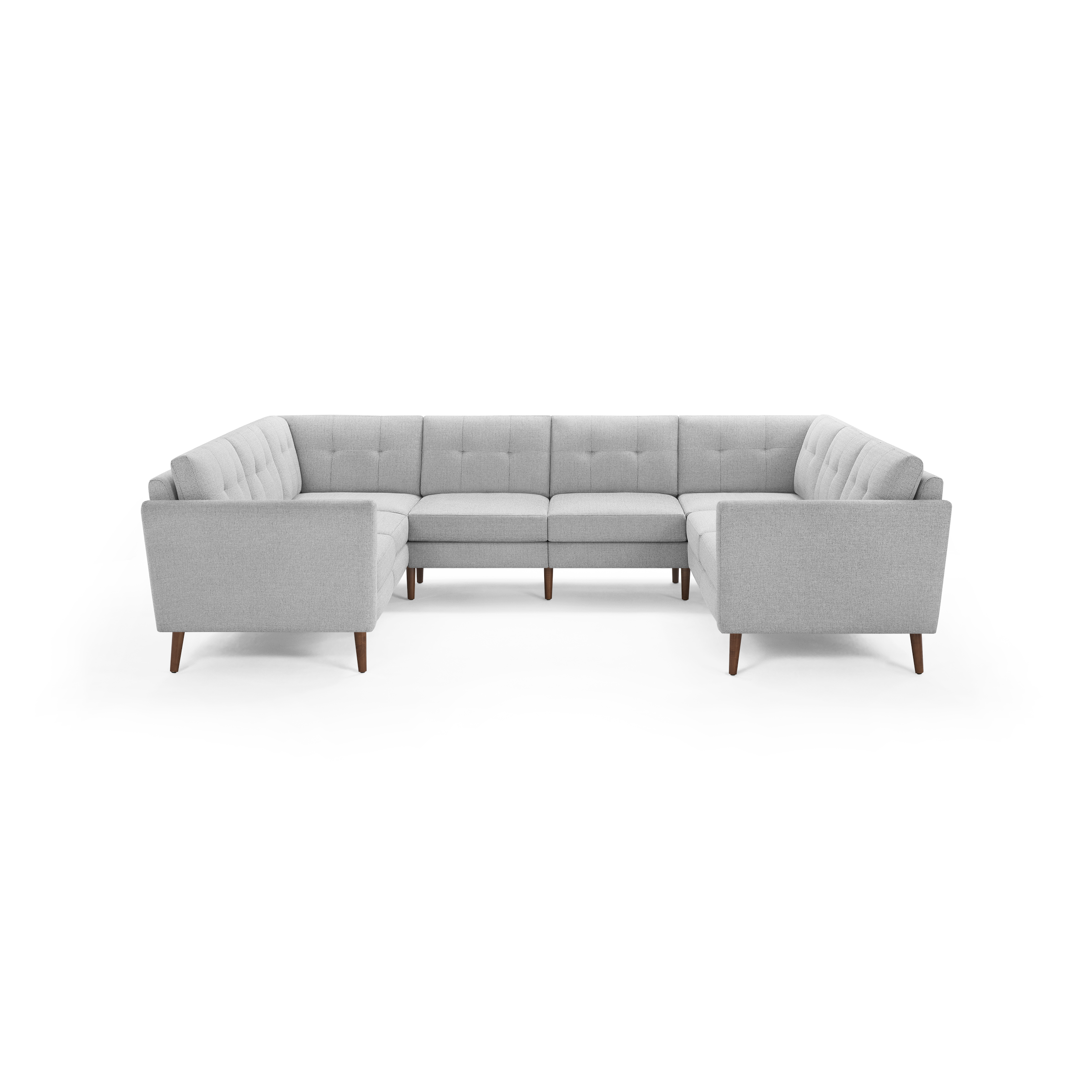 Light gray tufted fabric U-shaped sectional sofa with wooden tapered legs, mid-century modern design, spacious seating.