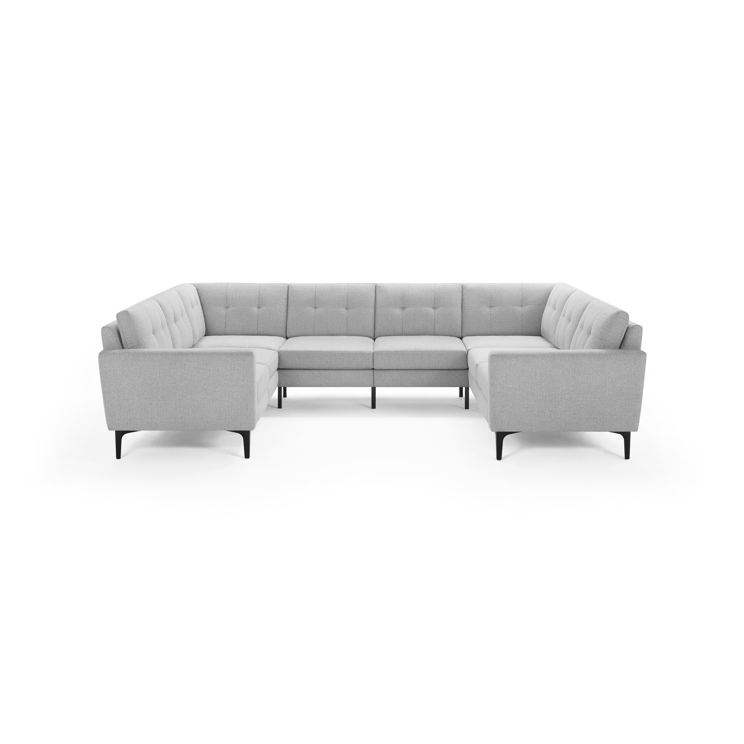 Light grey modern L-shaped sectional sofa with tufted back cushions and slim black legs on a transparent background.
