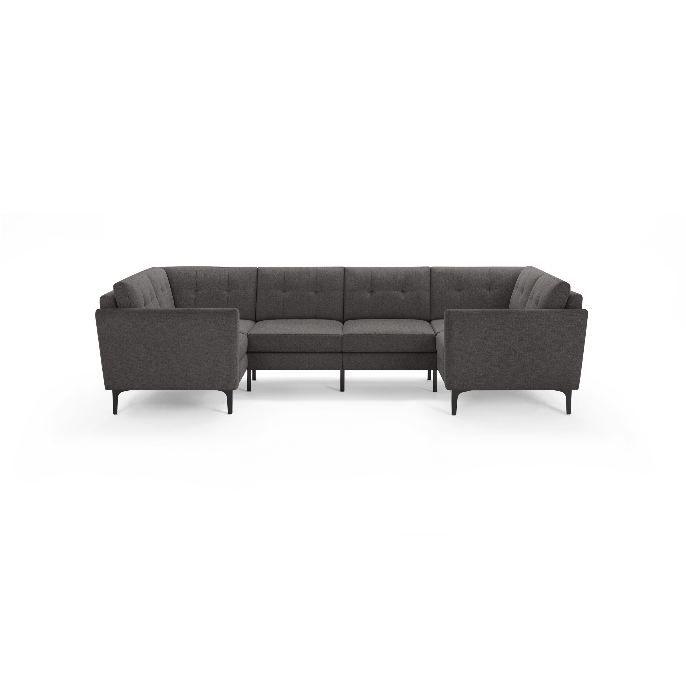 Dark gray fabric sectional sofa with tufted back cushions, straight arms, and slim black legs in a U-shape design.