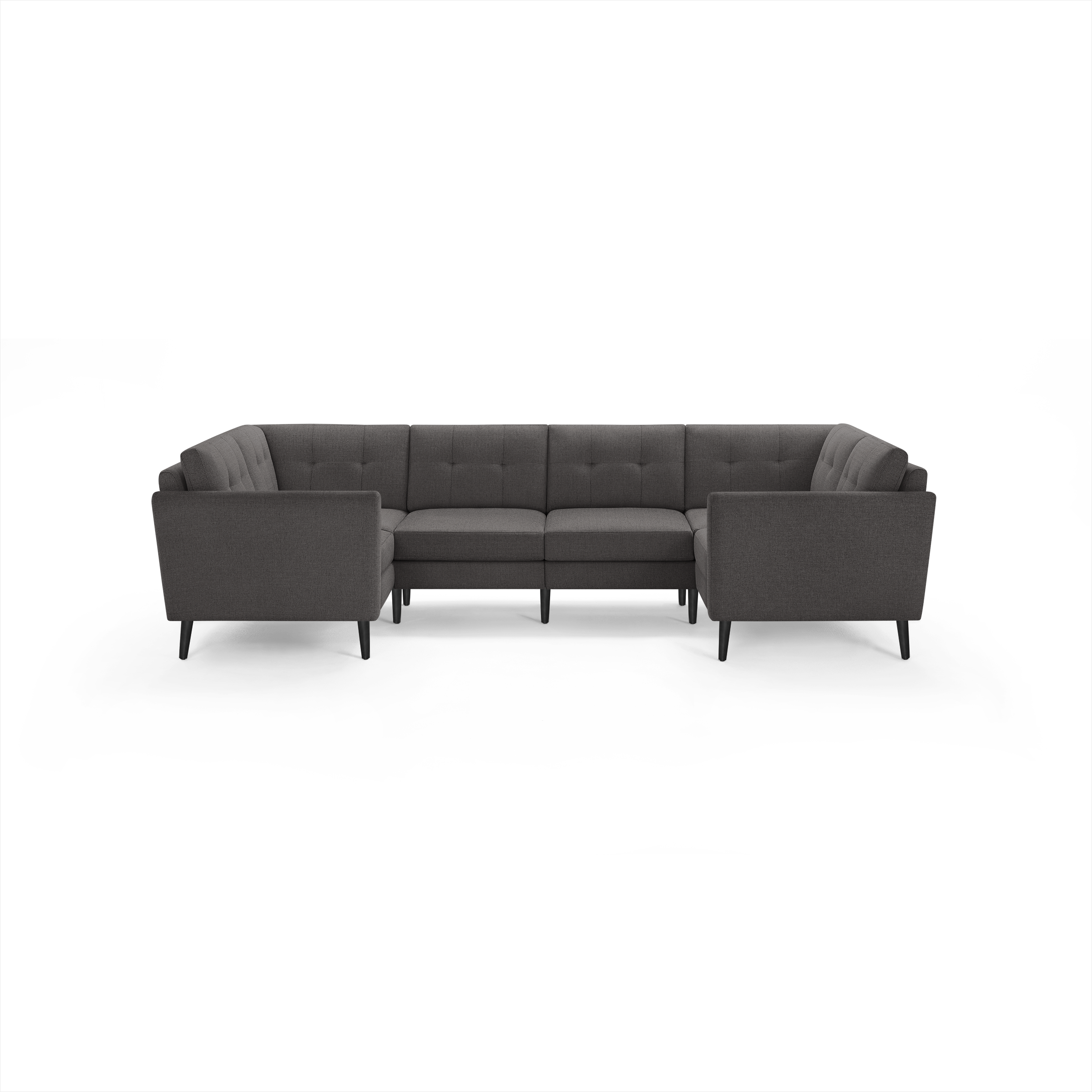 Dark gray fabric U-shaped sectional sofa with tufted cushions, straight armrests, and slender black legs.