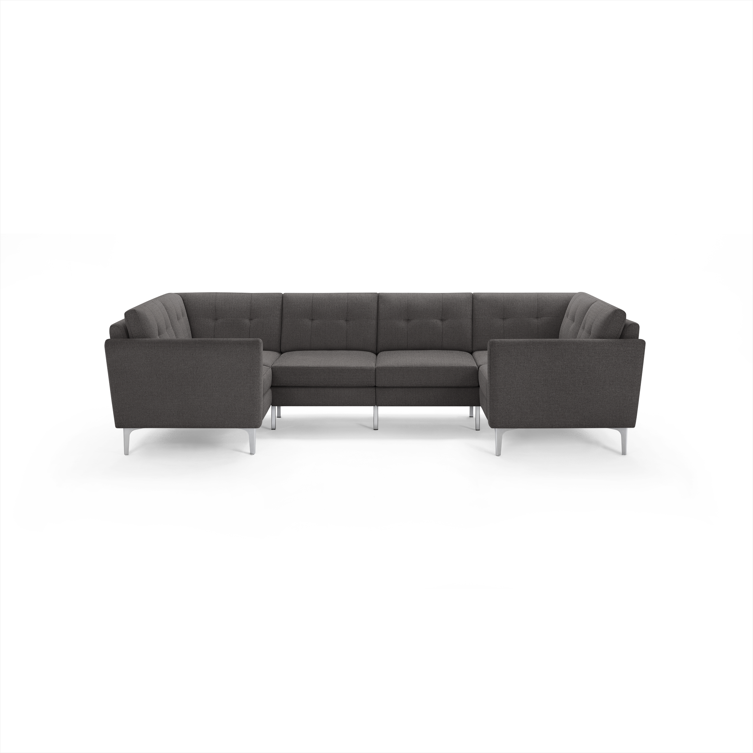 Dark gray fabric U-shaped sectional sofa with tufted back cushions and sleek silver metal legs, modern design.