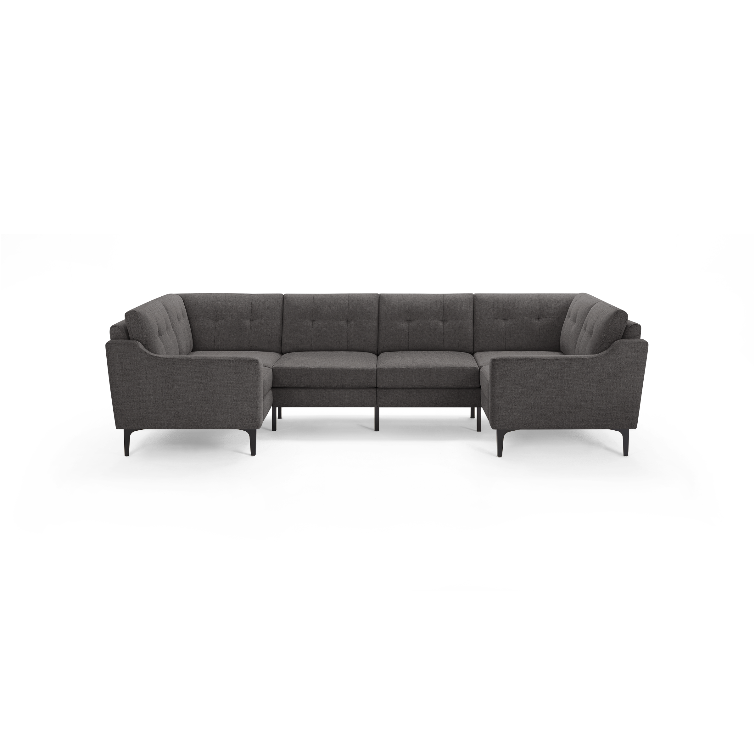 Dark gray fabric U-shaped sectional sofa with tufted cushions, slim armrests, and black metal legs.