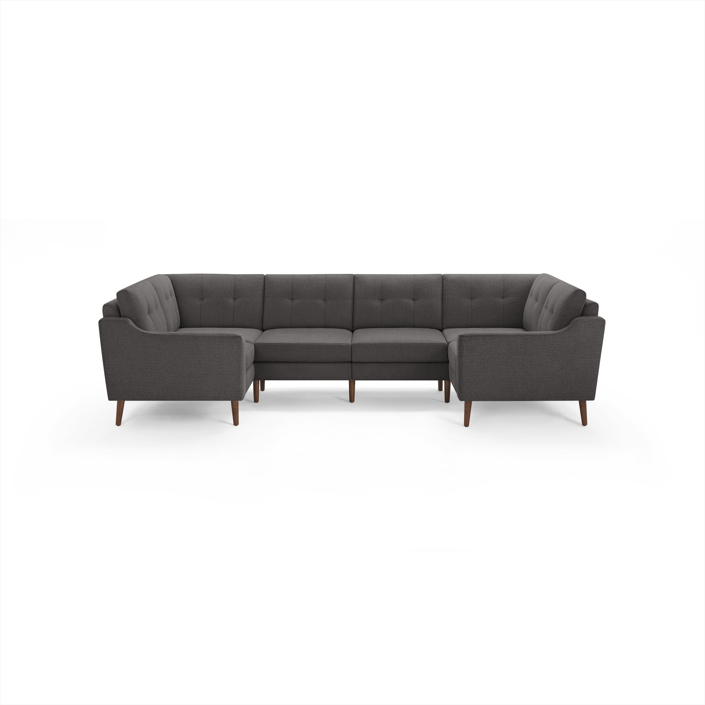 Dark gray fabric U-shaped sectional sofa with tufted backrests and wooden tapered legs, modern mid-century design.