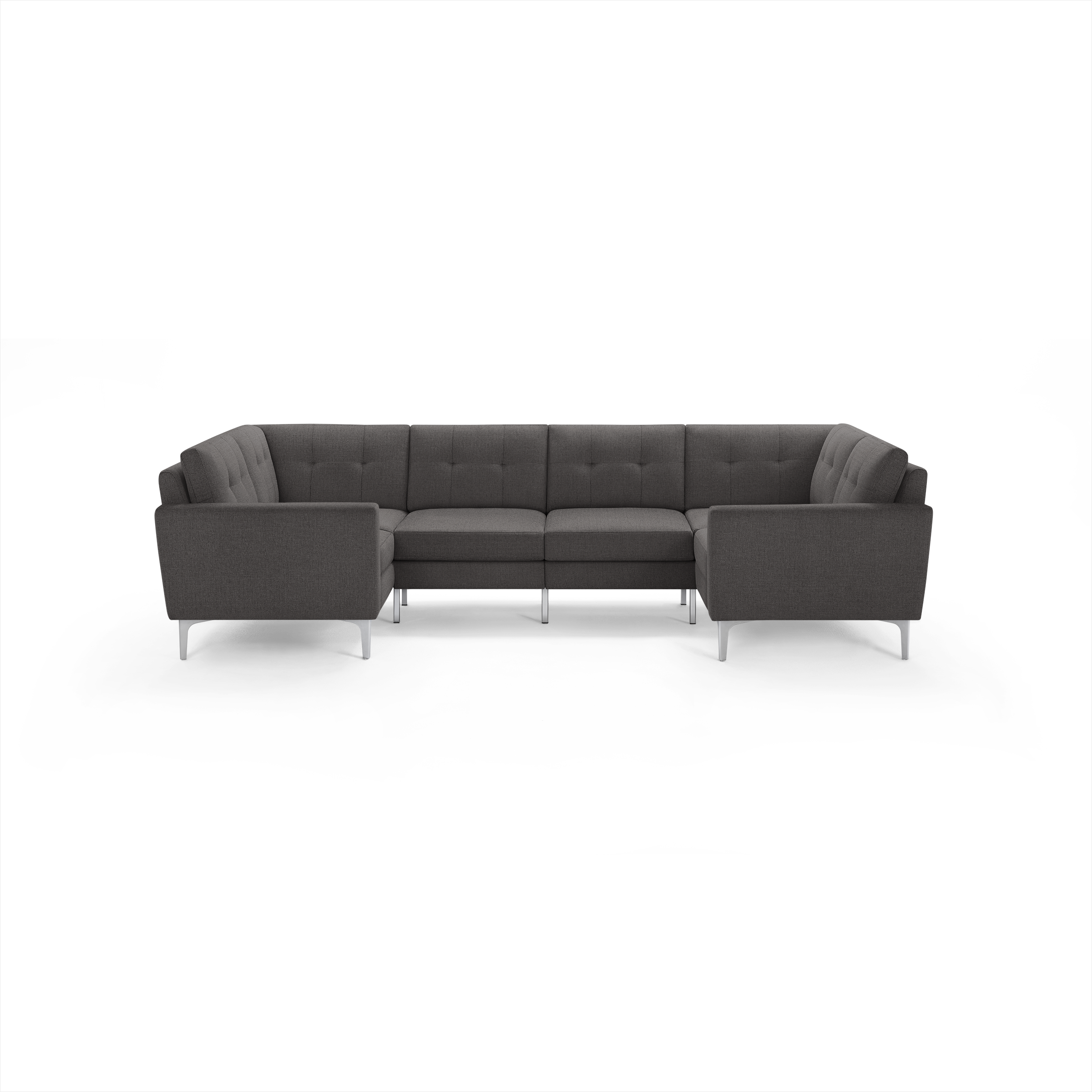 Dark gray modern U-shaped sectional sofa with tufted back cushions and slim metal legs on a black background.