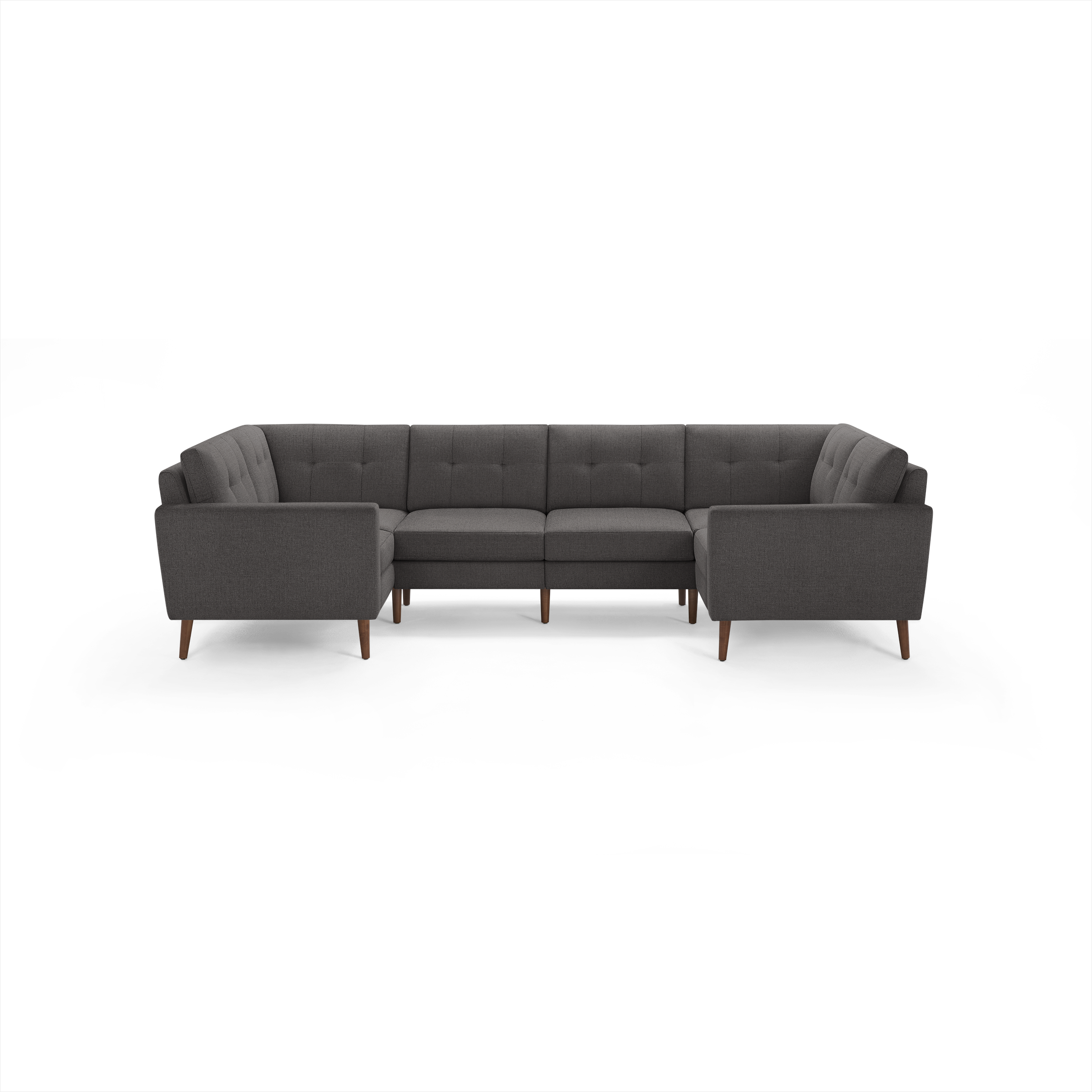 Dark gray fabric L-shaped sectional sofa with tufted back cushions and wooden legs, modern mid-century design.