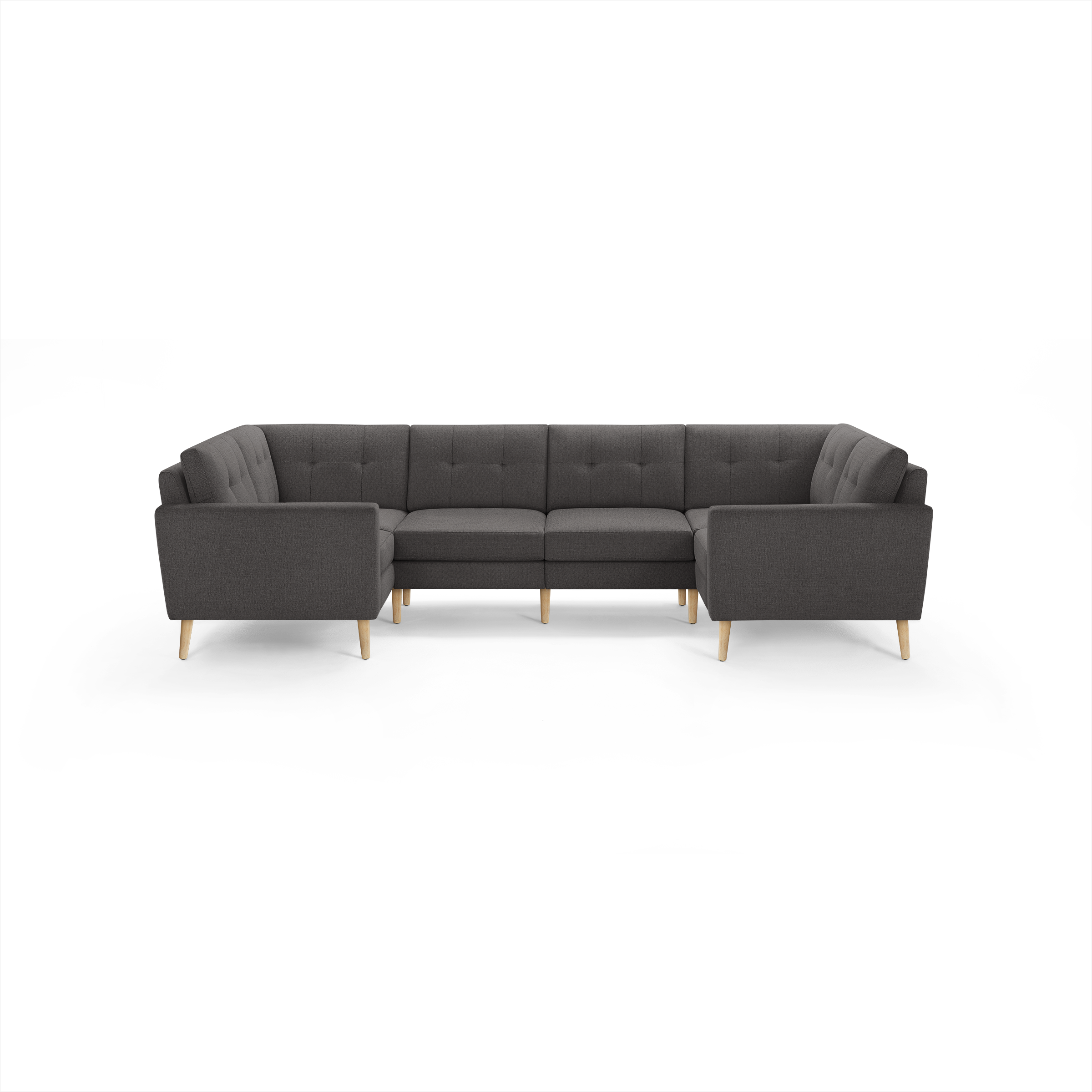 Dark gray upholstered U-shaped sectional sofa with tufted back cushions and natural wood legs, modern and spacious for living room seating.