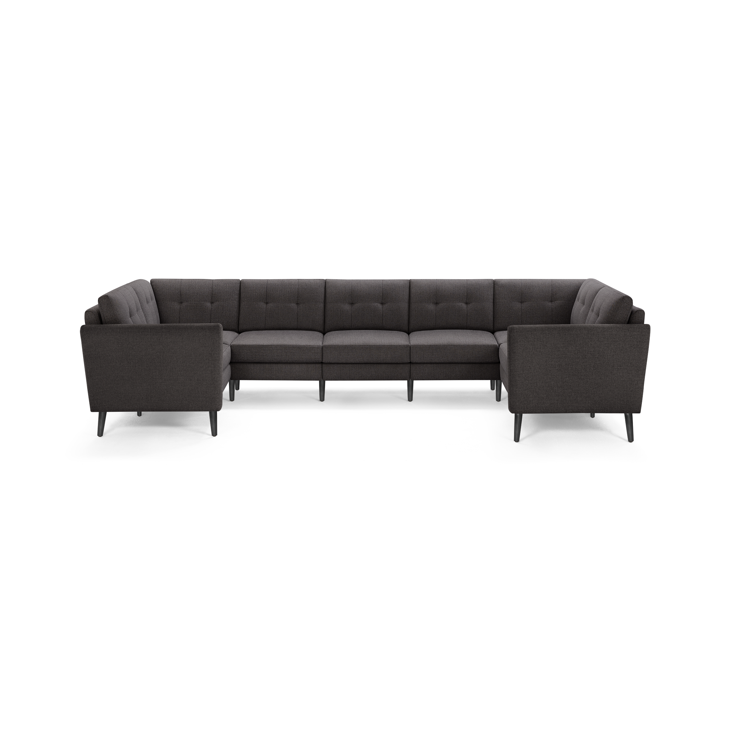 Large dark gray L-shaped sectional sofa with tufted back cushions and slim black legs, designed for modern living rooms.