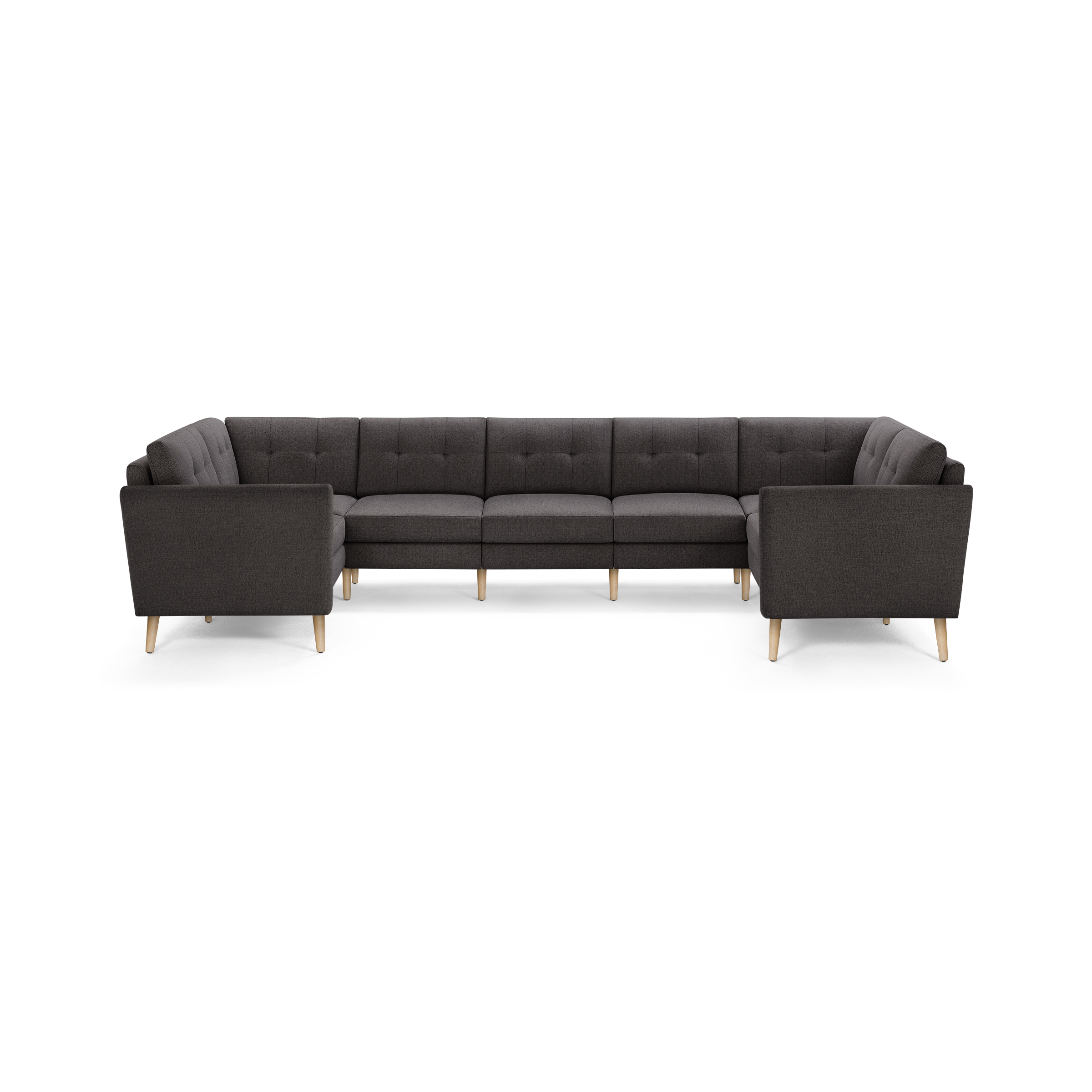 Large modern dark gray fabric sectional sofa with tufted back cushions and light wood tapered legs.