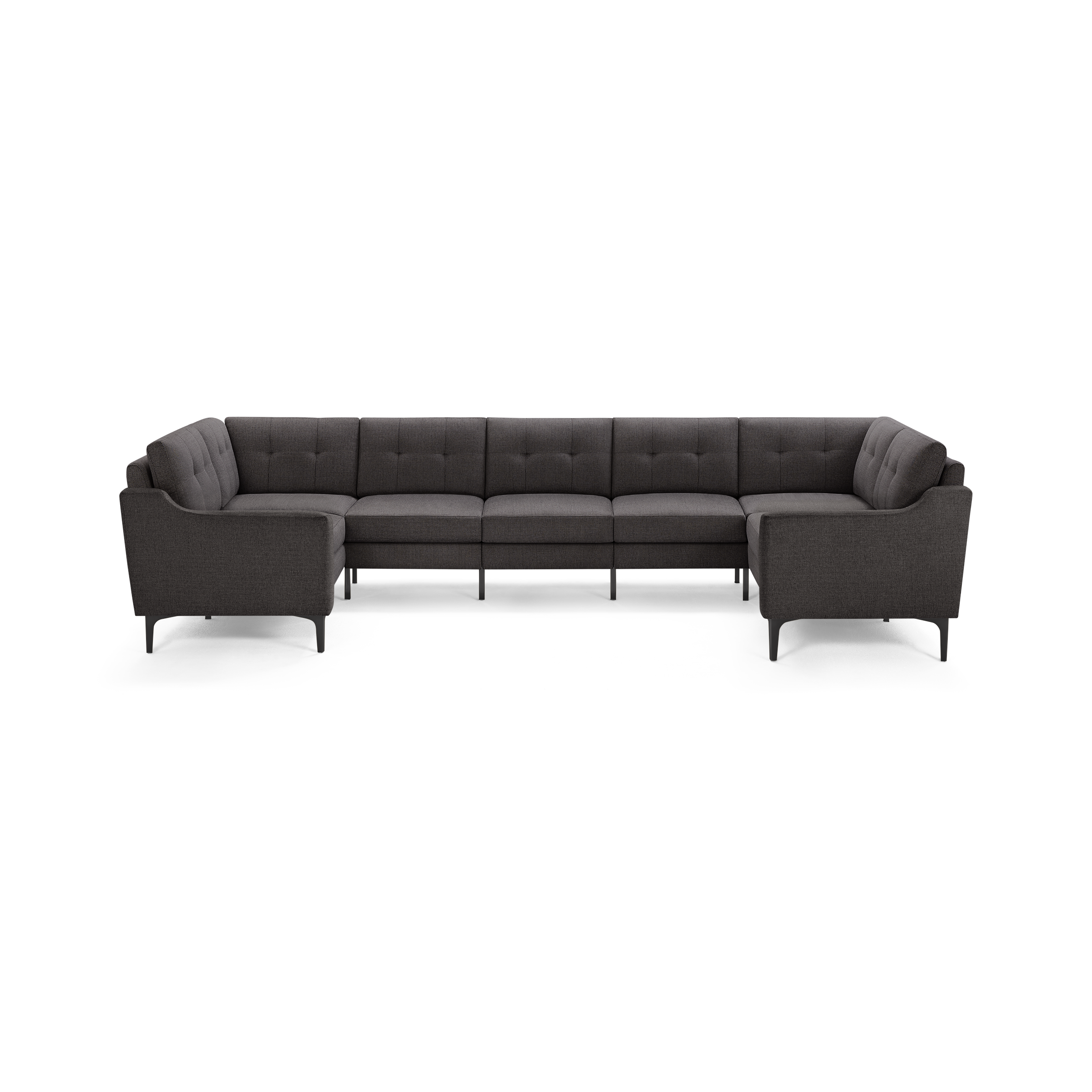 Large dark gray fabric sectional sofa with tufted back cushions, modern clean lines, and slender black legs, forming a U-shape.