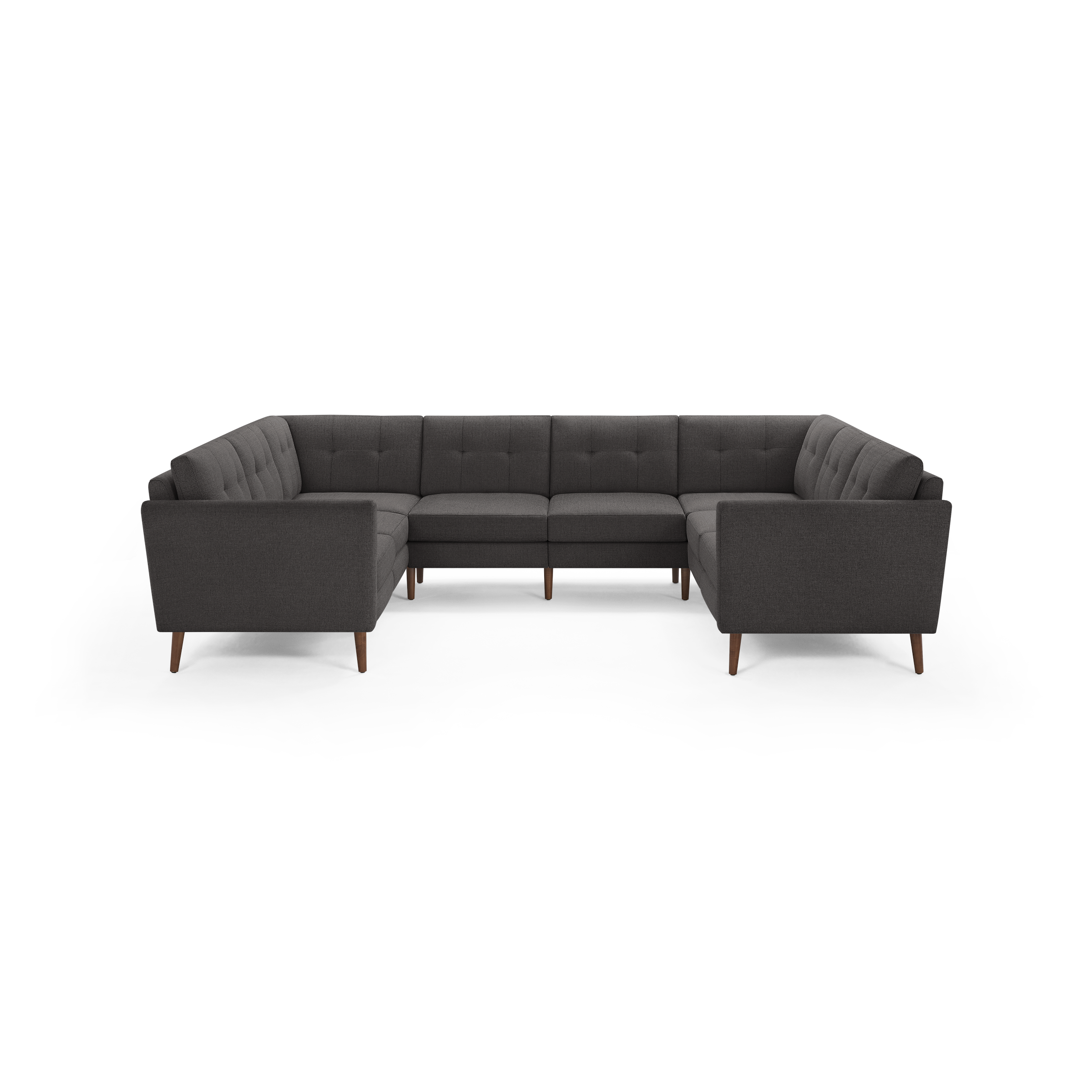 Dark gray fabric U-shaped sectional sofa with tufted back cushions and wooden tapered legs, modern mid-century design.