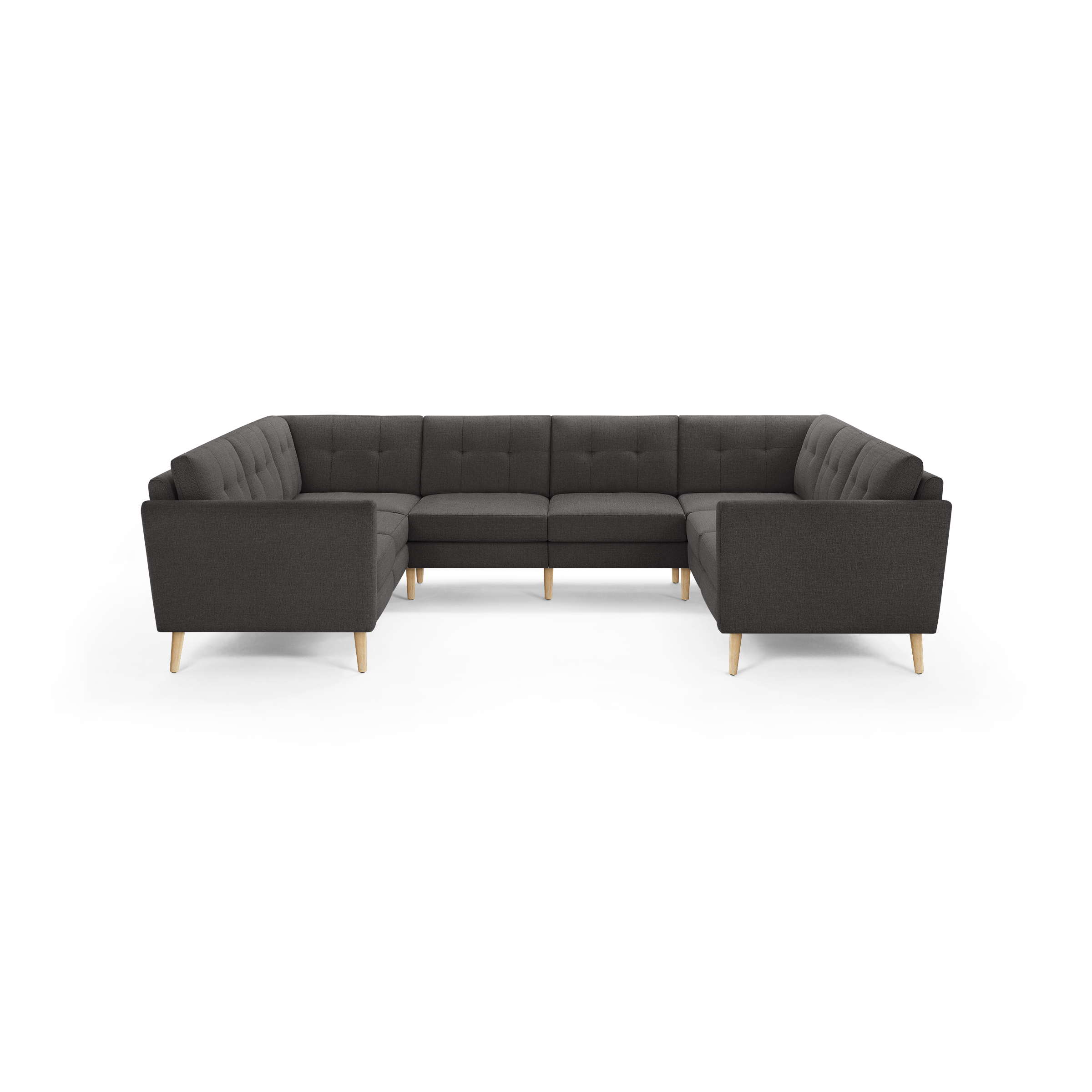 Dark gray fabric U-shaped sectional sofa with tufted back cushions and light wooden legs.