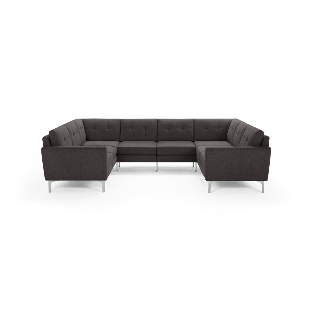 Dark gray modern U-shaped sectional sofa with tufted back cushions, sleek armrests, and silver metal legs.