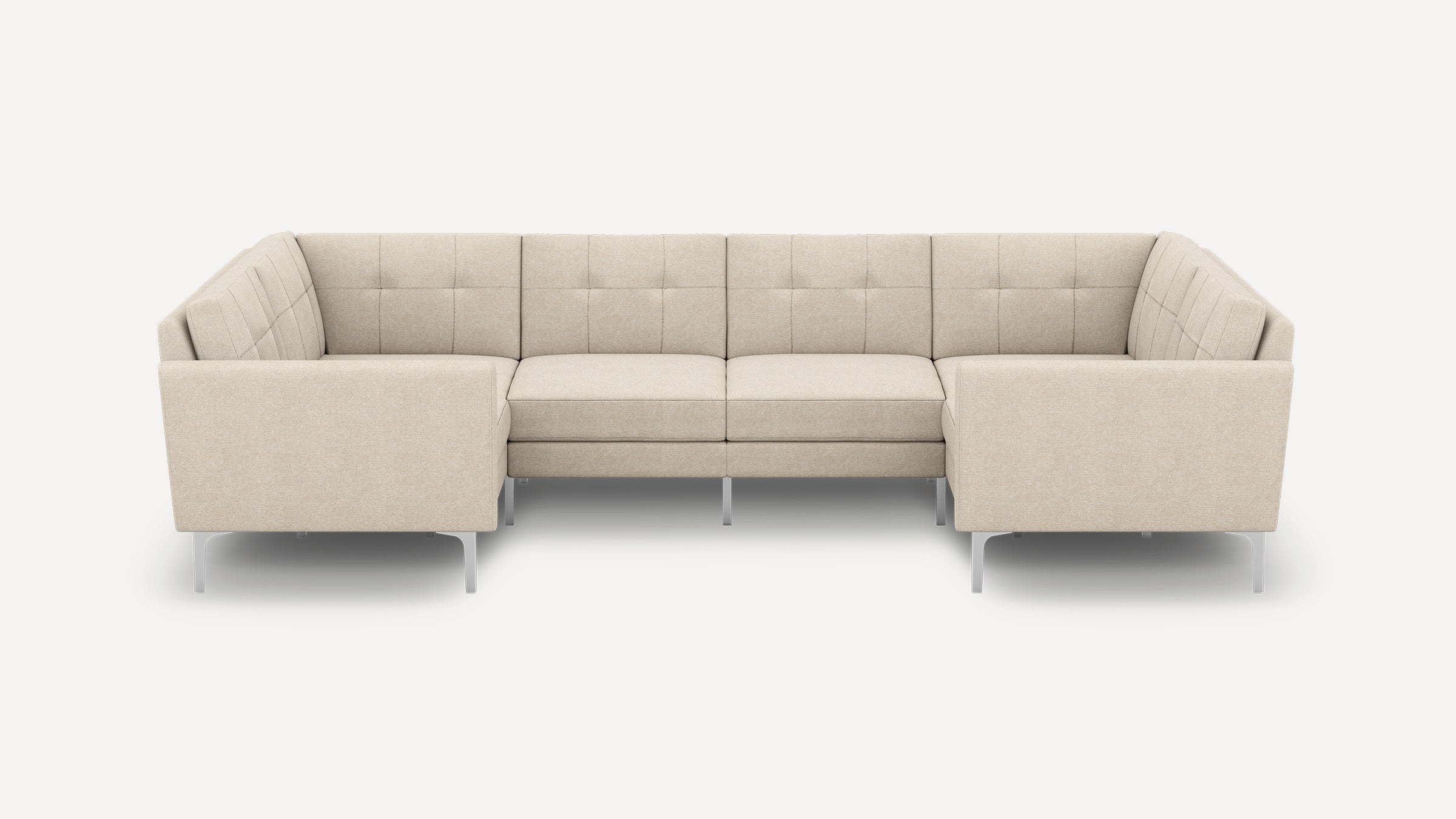 Beige fabric U-shaped sectional sofa with tufted back cushions, slim armrests, and modern metal legs on white background.