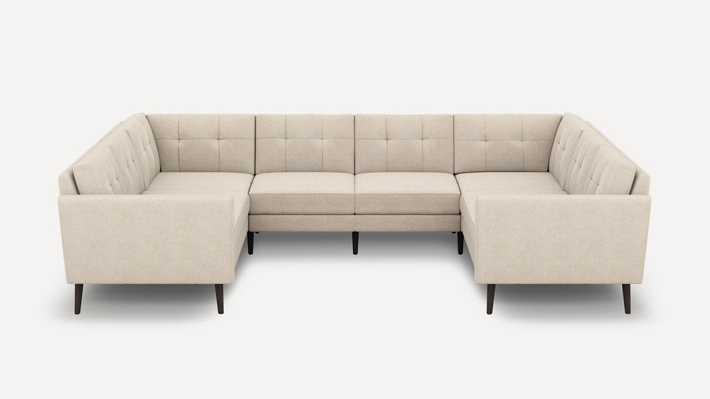 Beige U-shaped sectional sofa with tufted cushions, straight armrests, and dark wooden legs, designed for modern living spaces.