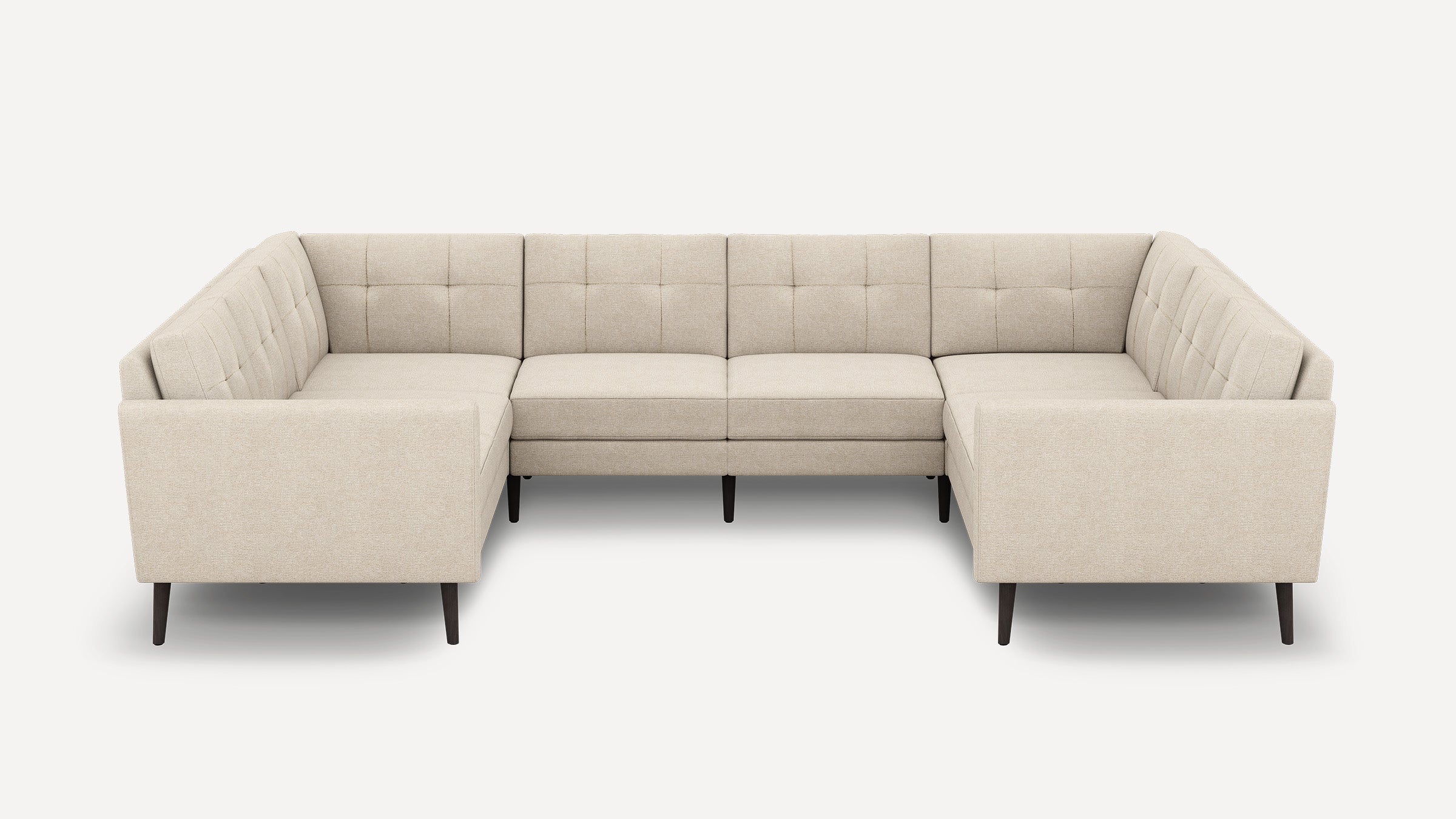 Beige U-shaped sectional sofa with tufted cushions, straight armrests, and dark wooden legs, designed for modern living spaces.