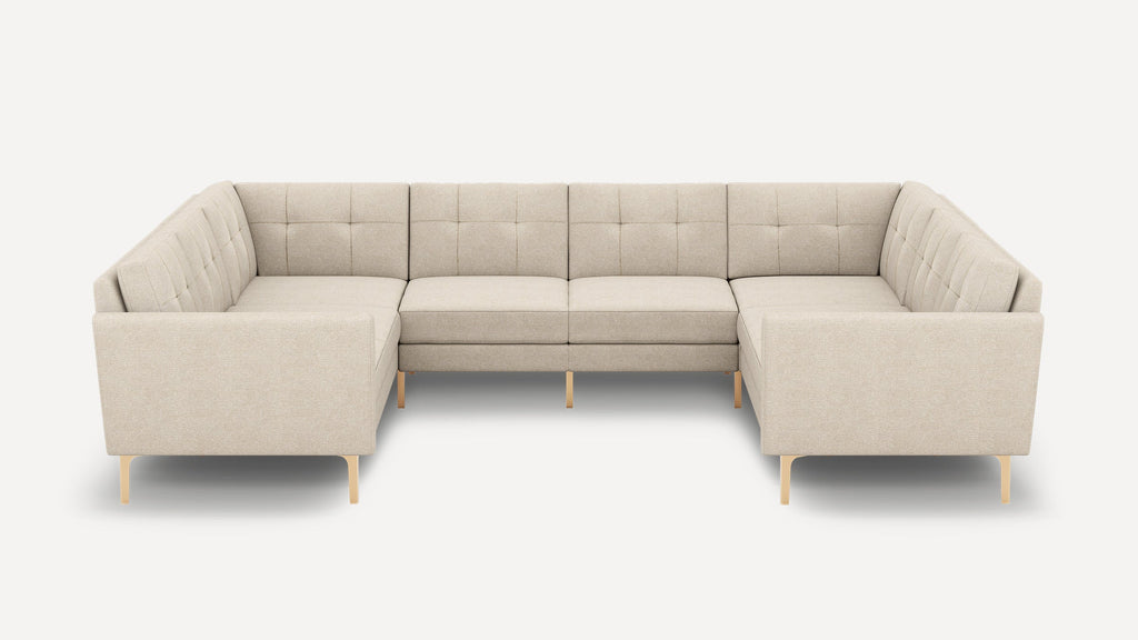 Modern beige fabric sectional sofa with tufted cushions and wooden legs, designed for spacious corner seating.
