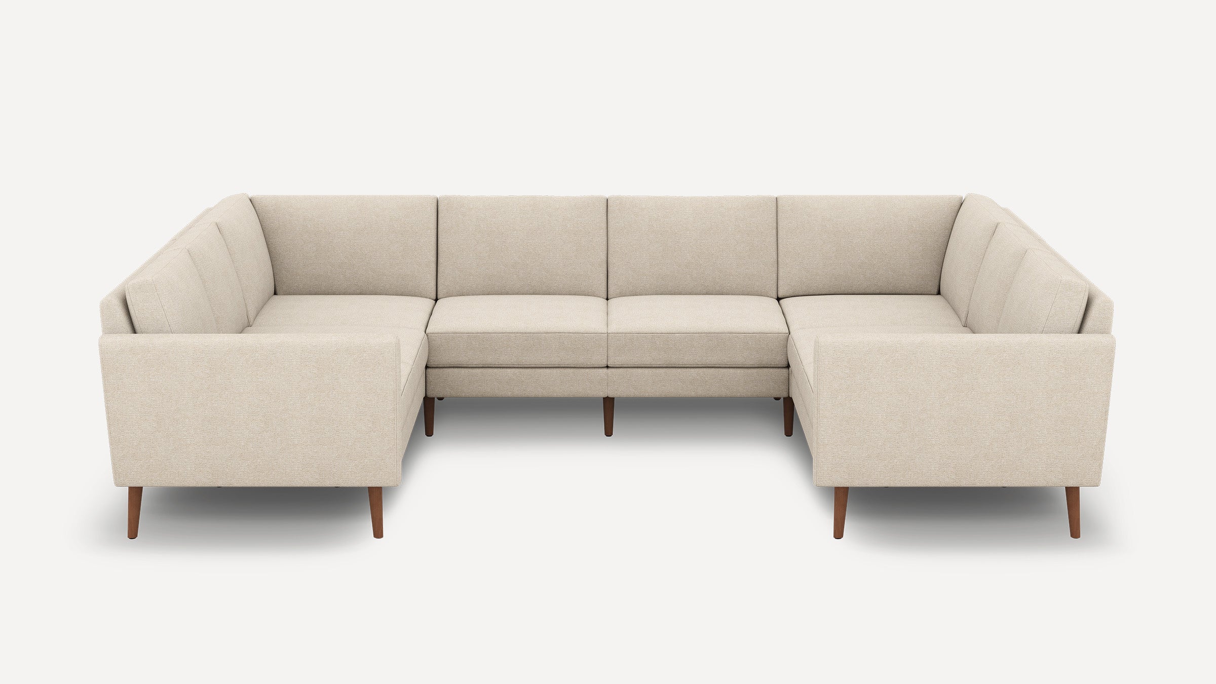 Beige L-shaped sectional sofa with mid-century modern design, tufted cushions, and wooden tapered legs on a white background.