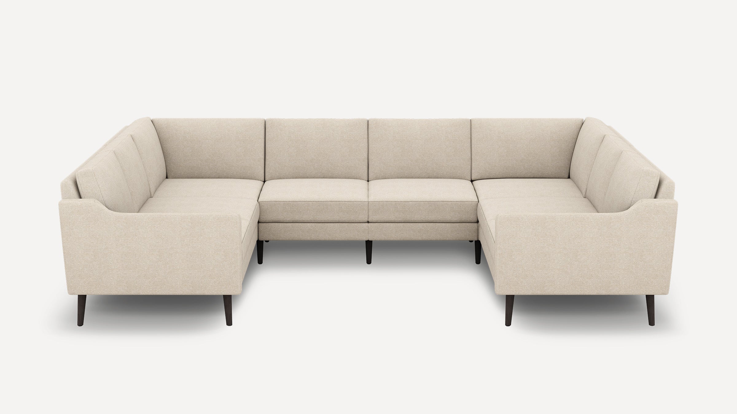 Beige fabric sectional sofa with clean lines, tufted cushions, and dark wooden legs in an L-shaped configuration.