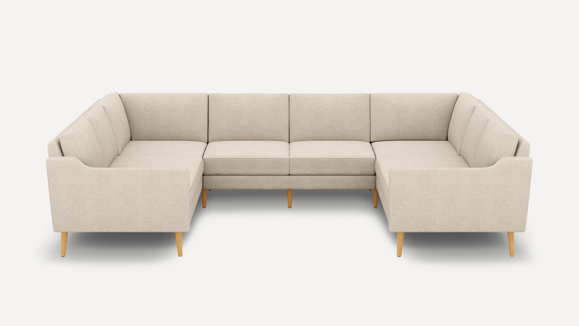 Beige fabric U-shaped sectional sofa with wooden legs, featuring clean lines and modern minimalist design.