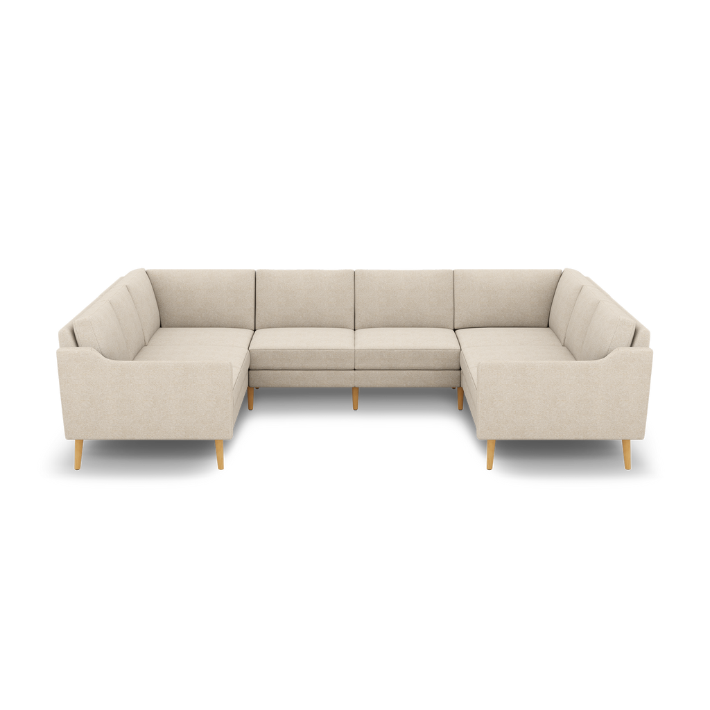 Beige upholstered modern U-shaped sectional sofa with wooden legs, featuring clean lines and cushioned backrests.