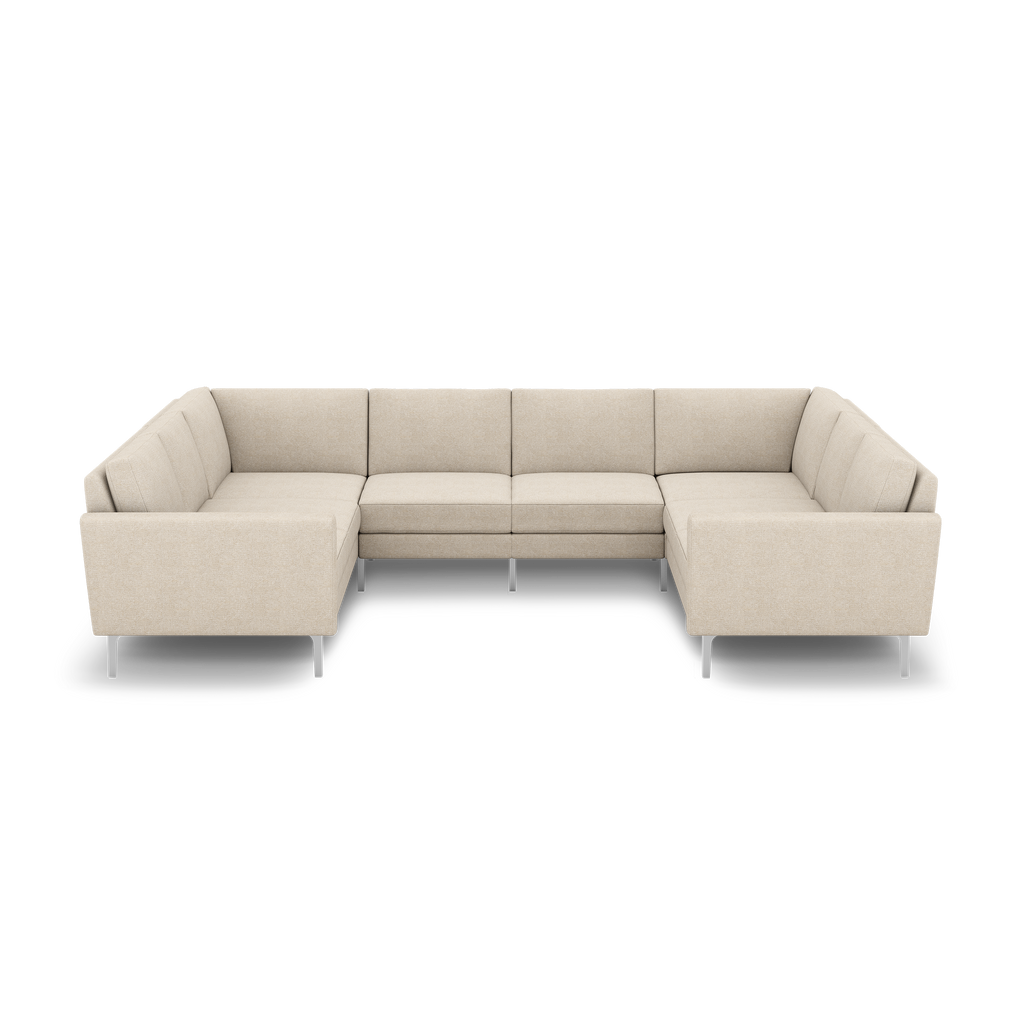 Beige fabric U-shaped sectional sofa with metal legs, featuring clean lines and cushioned backrests, ideal for modern living spaces.