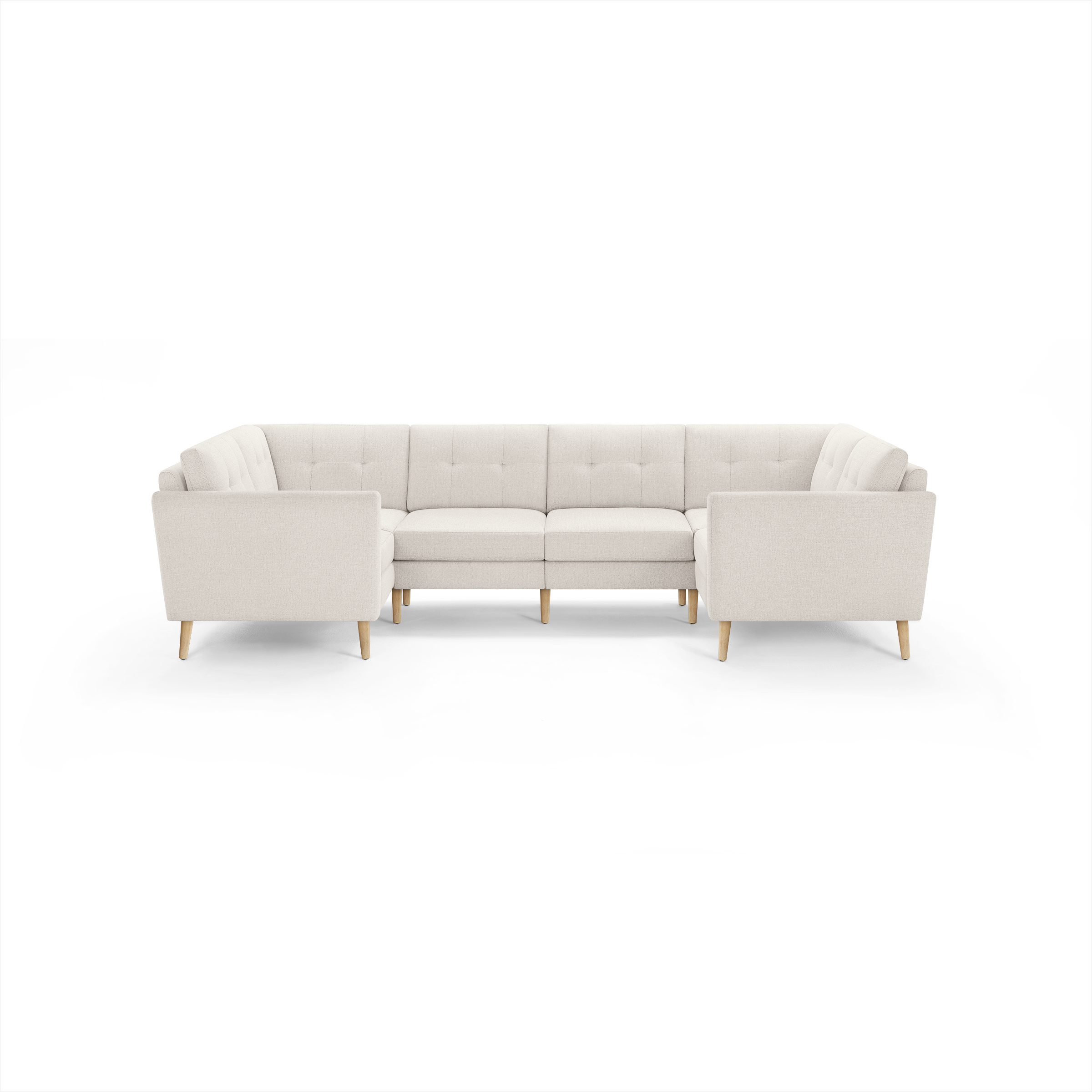 Light beige fabric U-shaped sectional sofa with tufted back cushions and wooden legs, designed for spacious seating.