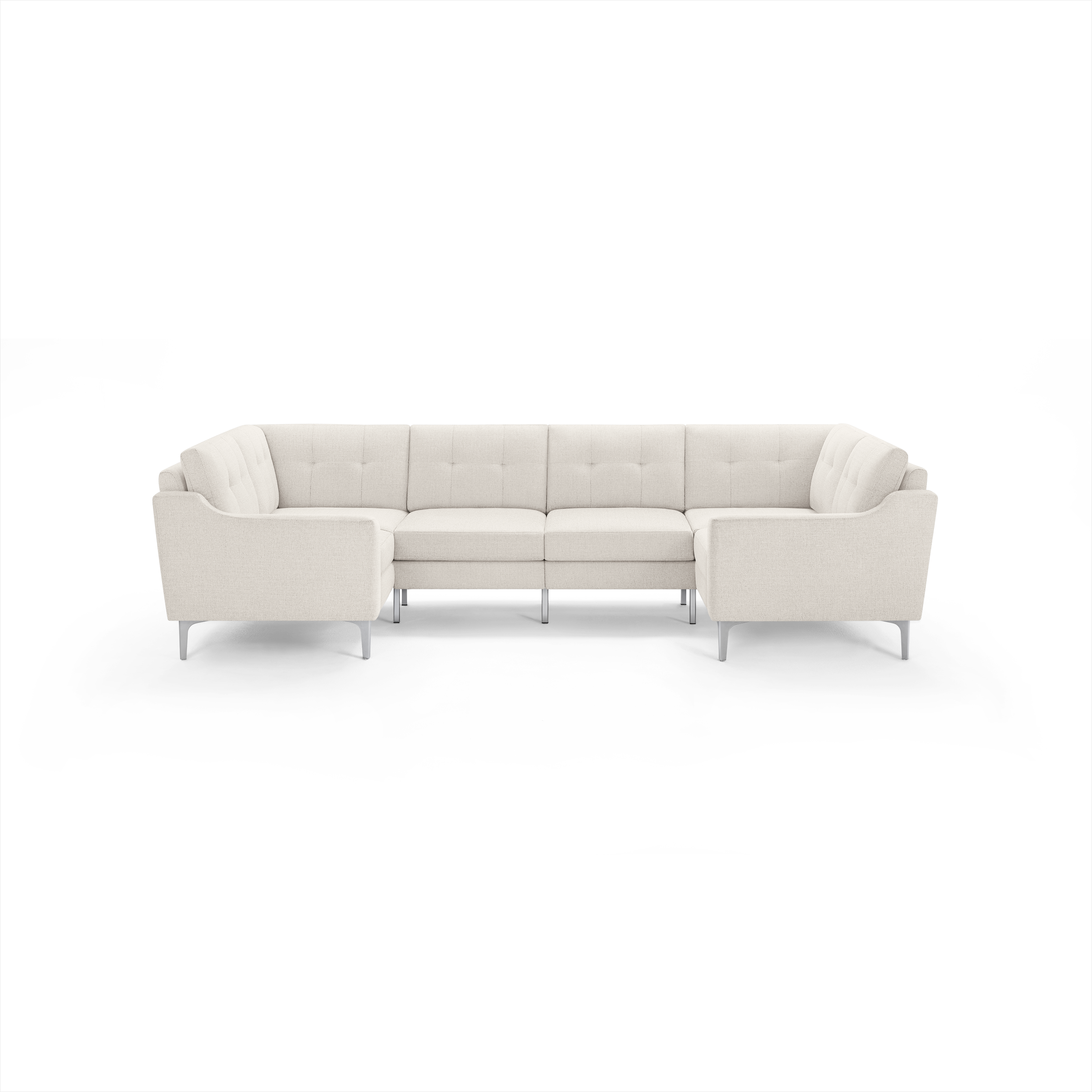 Modern U-shaped sectional sofa in light beige fabric with tufted cushions and slim metal legs, designed for spacious seating.