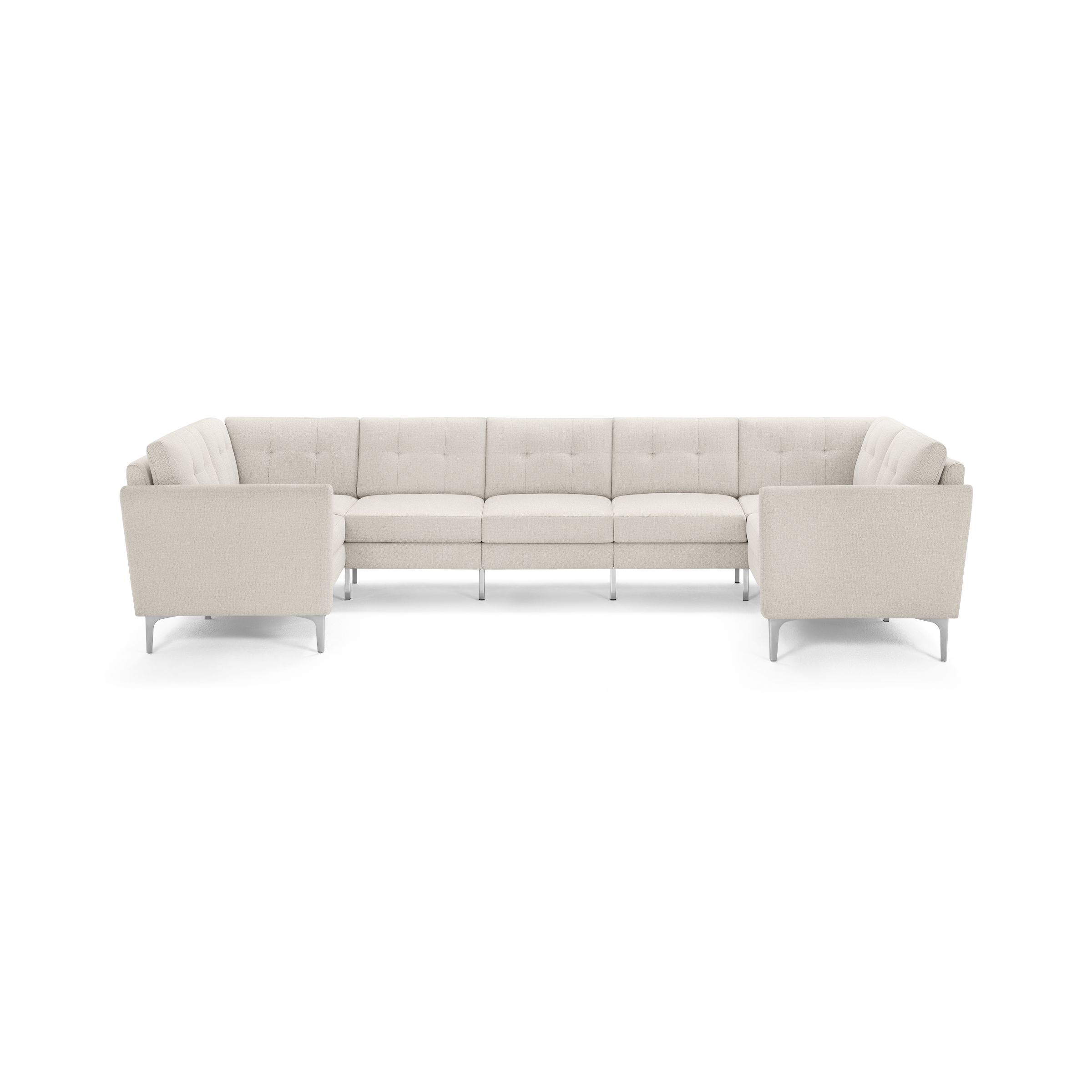 Modern U-shaped sectional sofa with light beige tufted upholstery and slim metal legs, designed for spacious seating.
