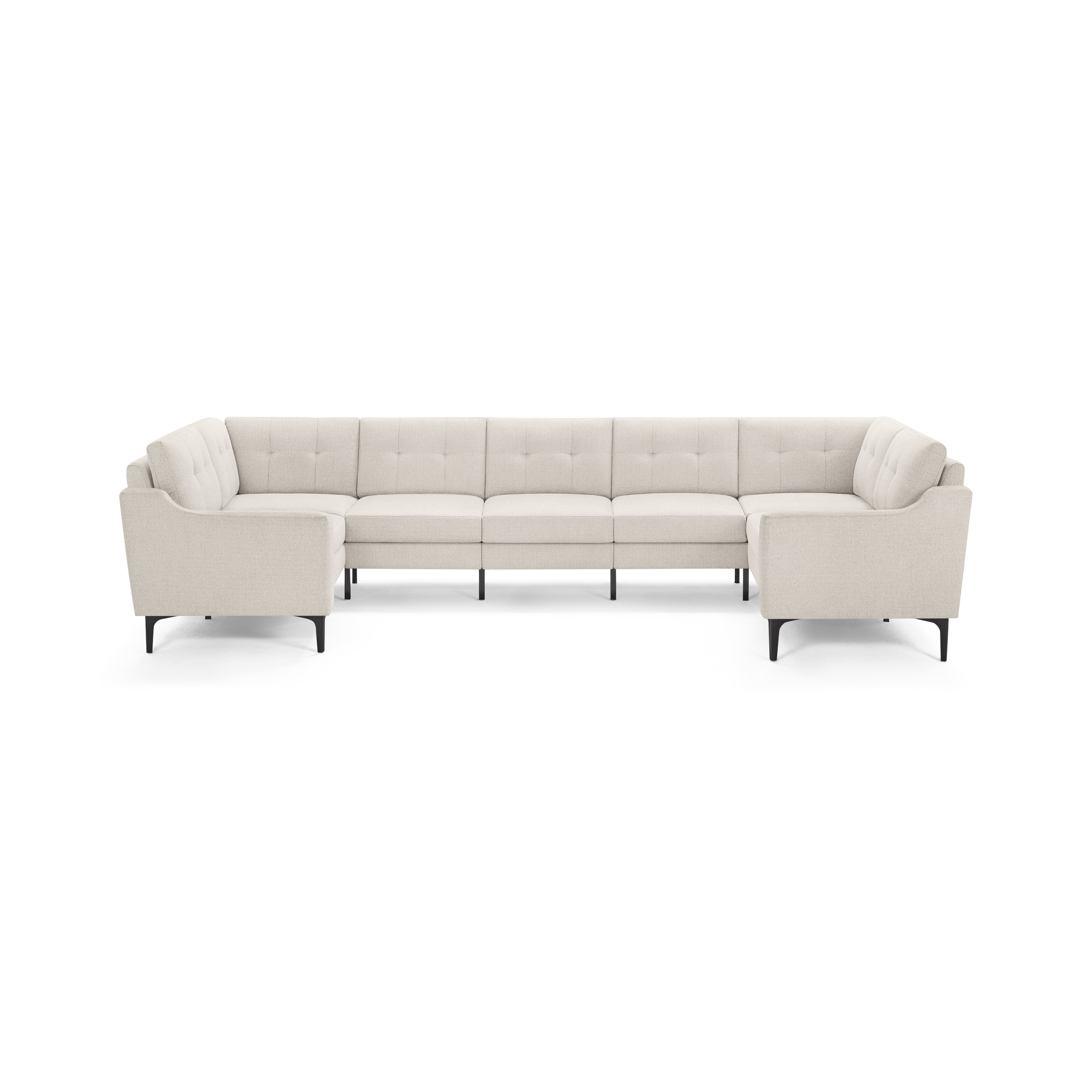 Beige upholstered modern sectional sofa with tufted cushions and black tapered legs, designed in an L-shape for spacious seating.