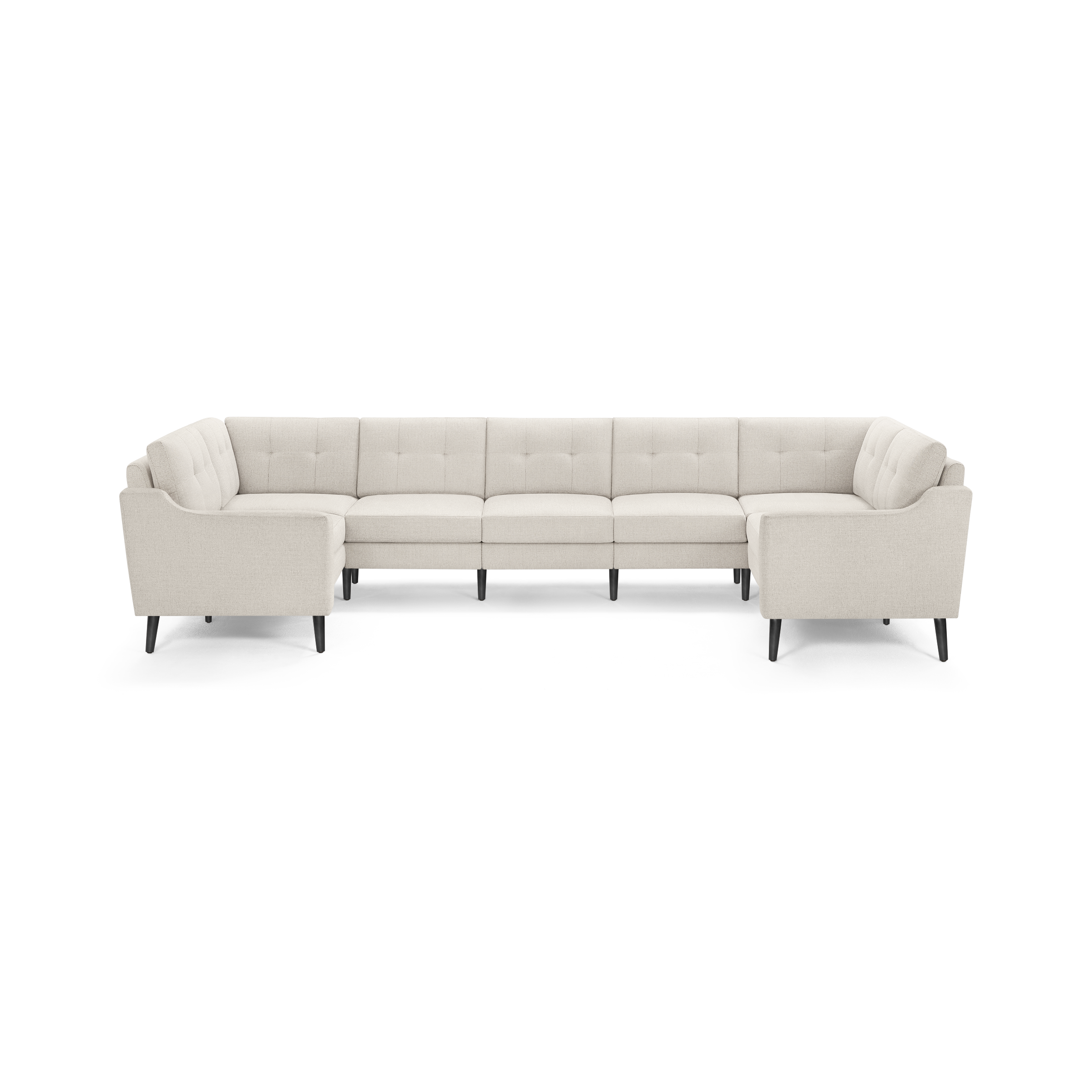 Beige fabric U-shaped sectional sofa with tufted back cushions and black tapered legs, designed for spacious seating.