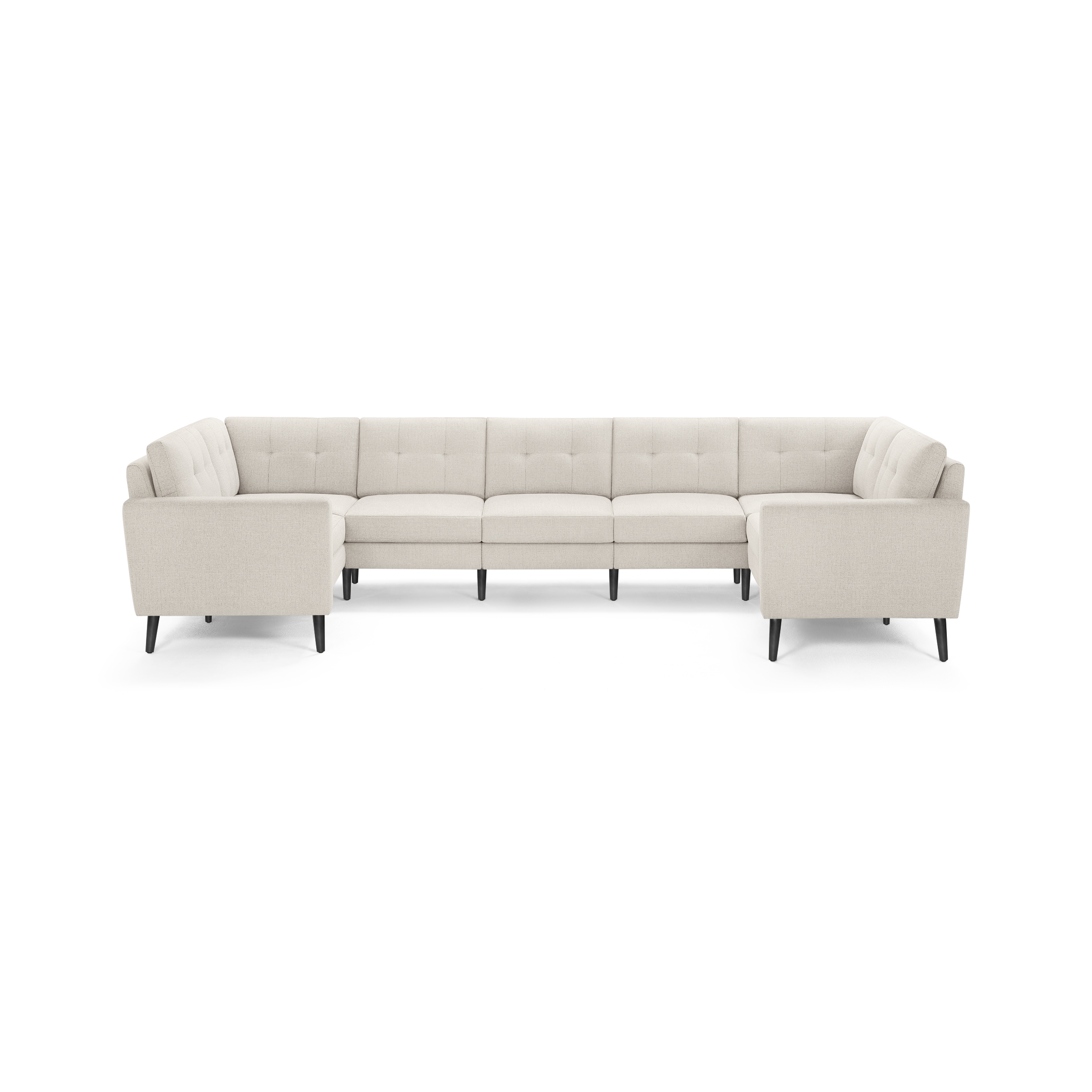 Beige upholstered U-shaped sectional sofa with tufted back cushions and black tapered wooden legs, designed for spacious seating.