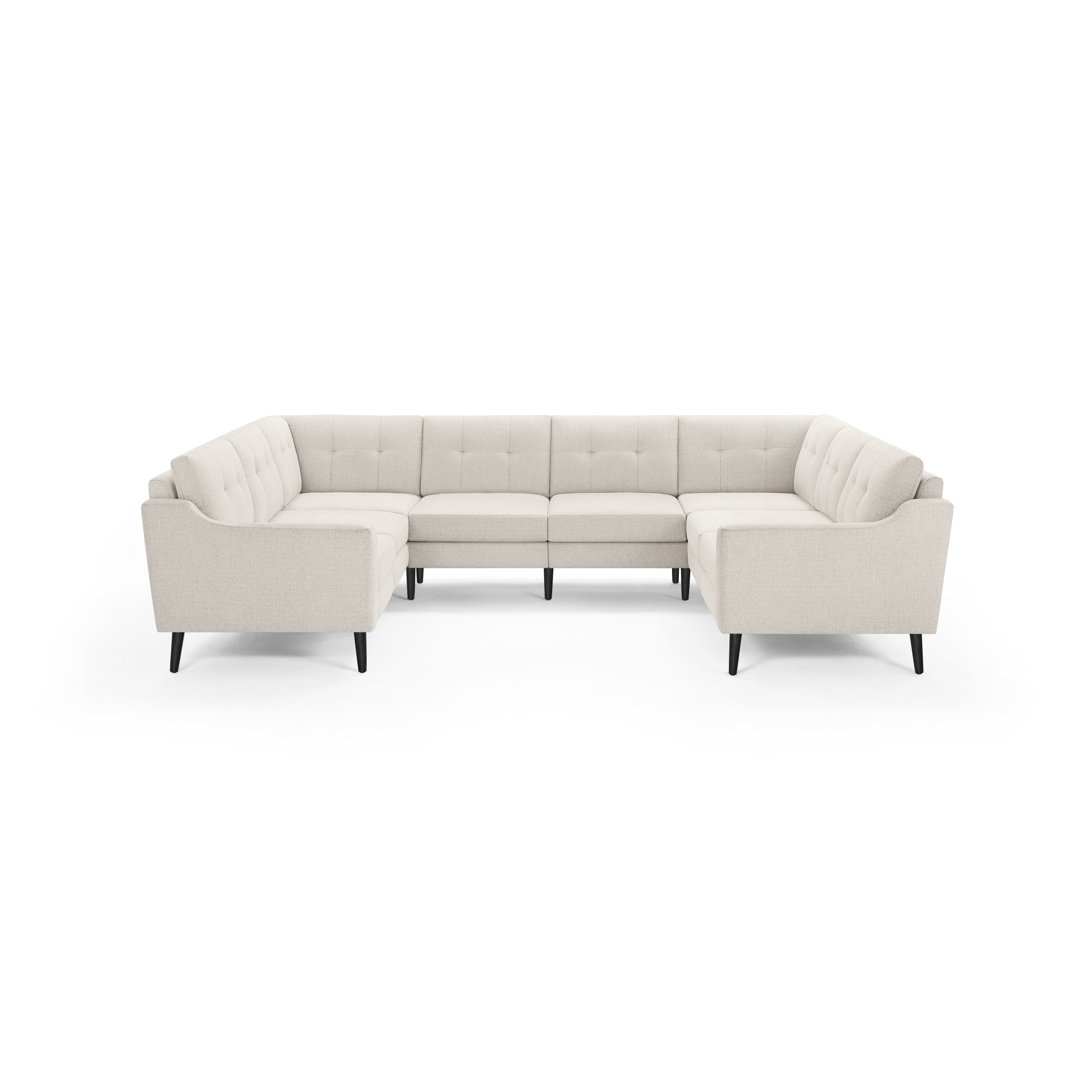 Cream-colored upholstered U-shaped sectional sofa with tufted back cushions and black wooden legs.