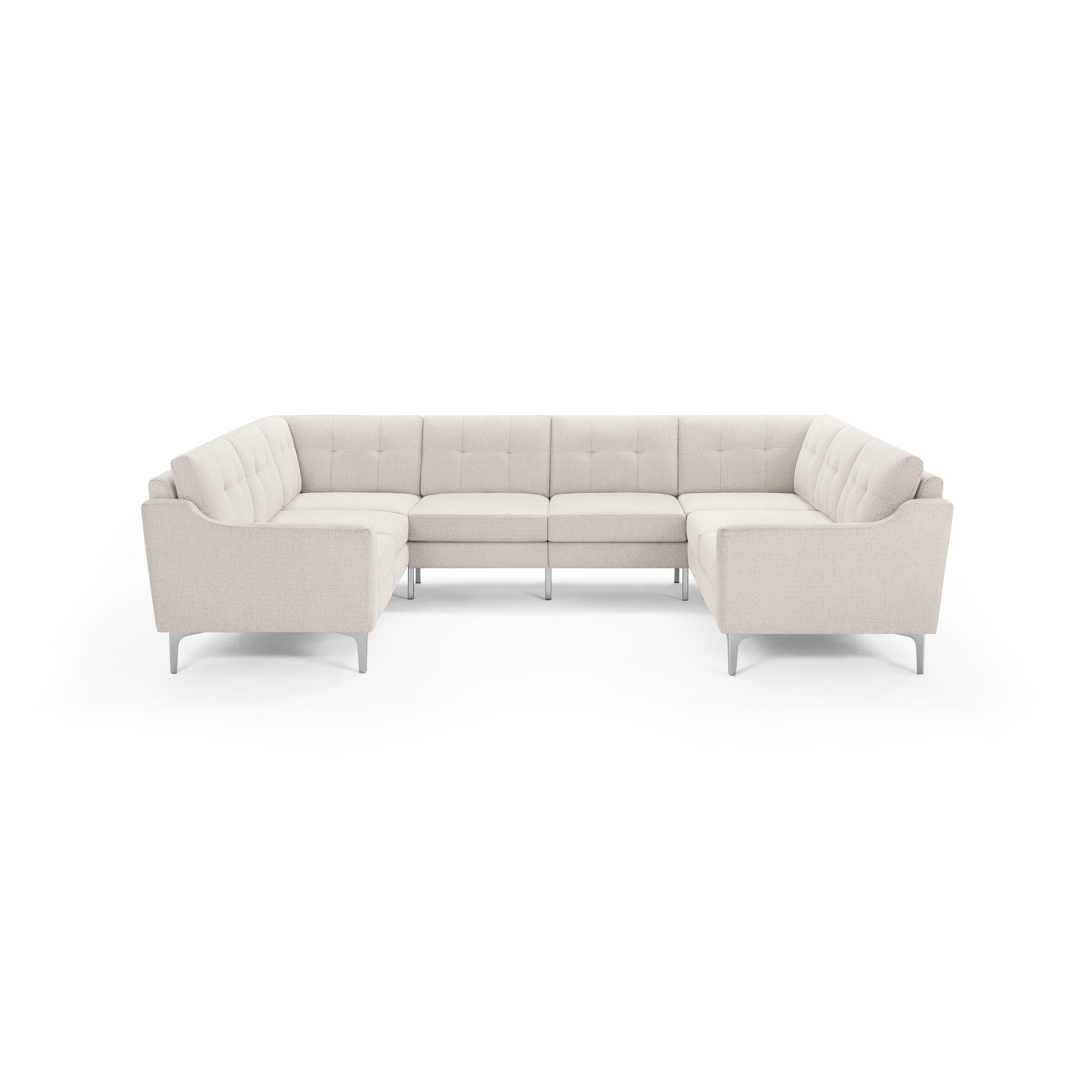 Beige sectional sofa with tufted back cushions, clean lines, silver metal legs, and a U-shaped design for spacious seating.