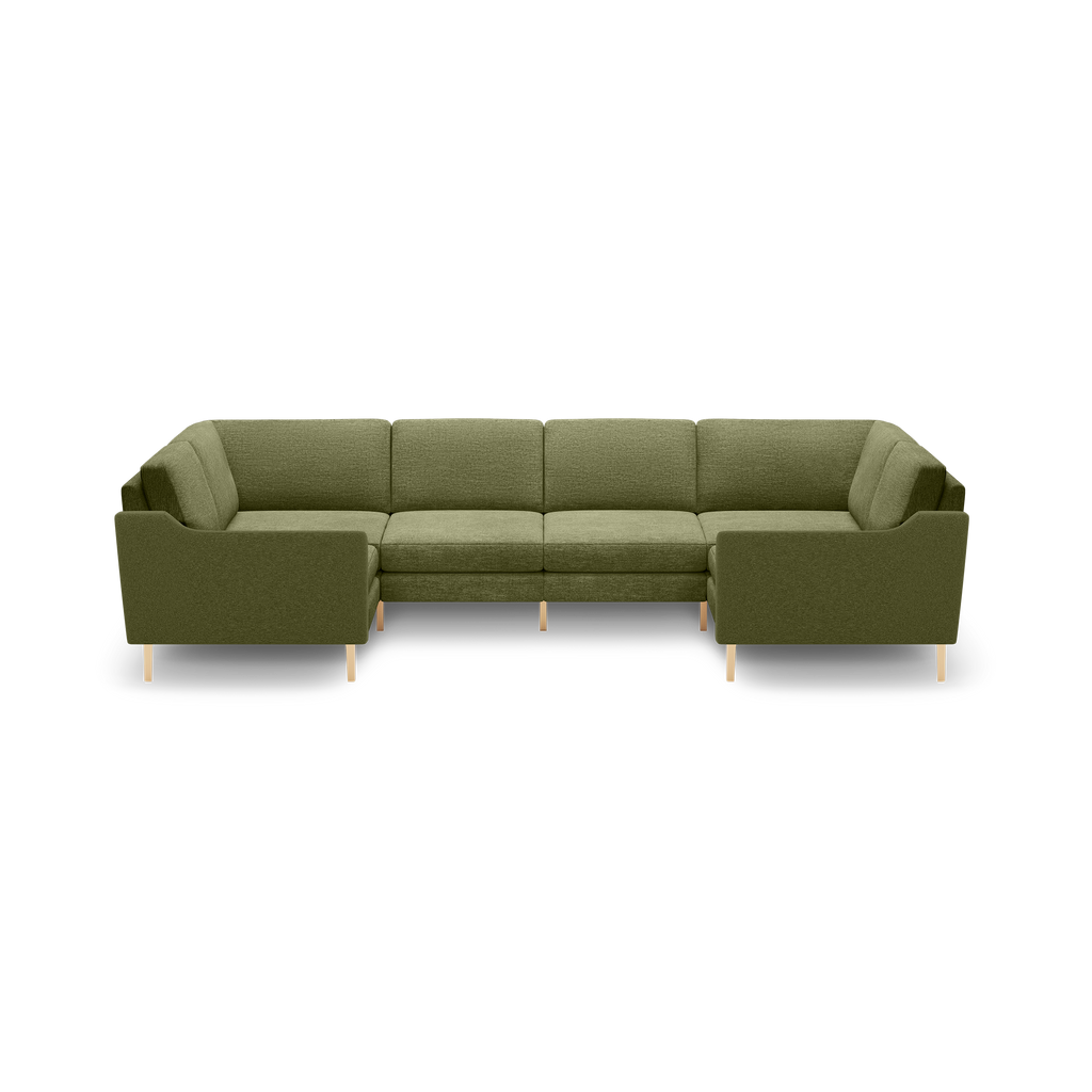Olive green fabric U-shaped sectional sofa with clean lines, cushioned seats, and light wooden legs, set against a black background.