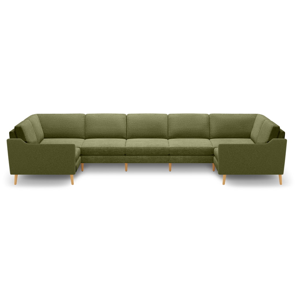 Large olive green sectional sofa with wooden legs, featuring clean lines and cushioned seats and backs.