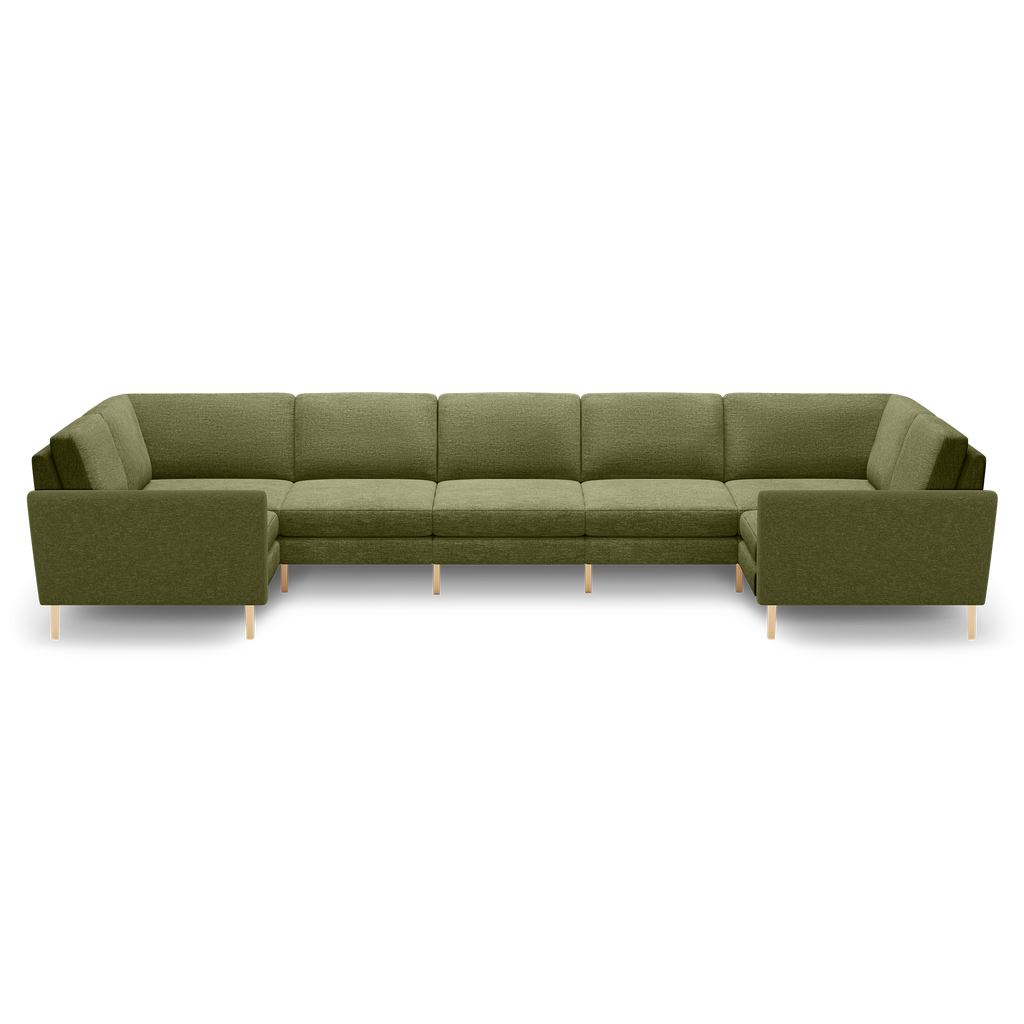 Large olive green fabric sectional sofa with clean lines, cushioned seats, and natural wooden legs, designed for spacious seating.