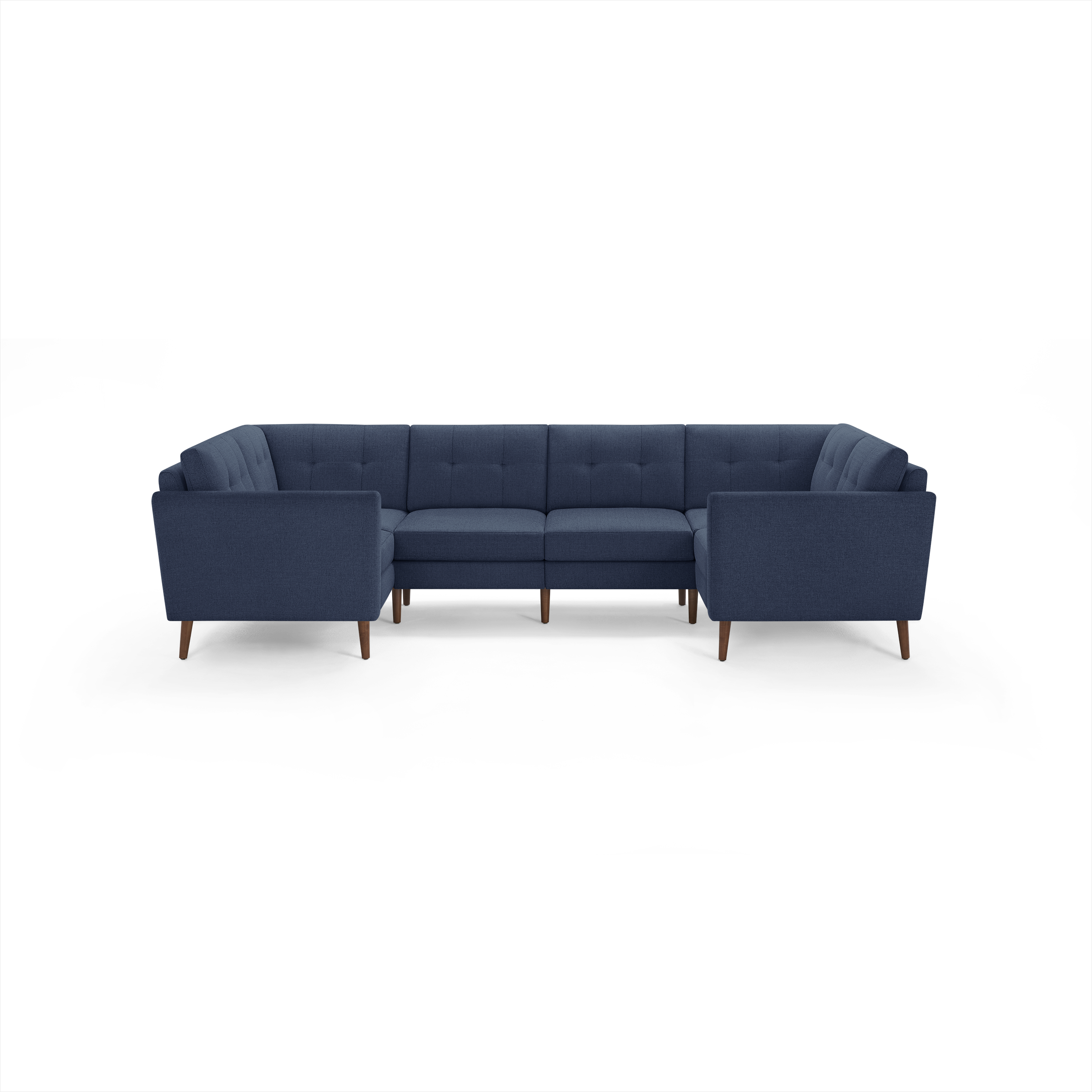 Dark blue fabric U-shaped sectional sofa with tufted back cushions and wooden legs, designed for spacious living areas.