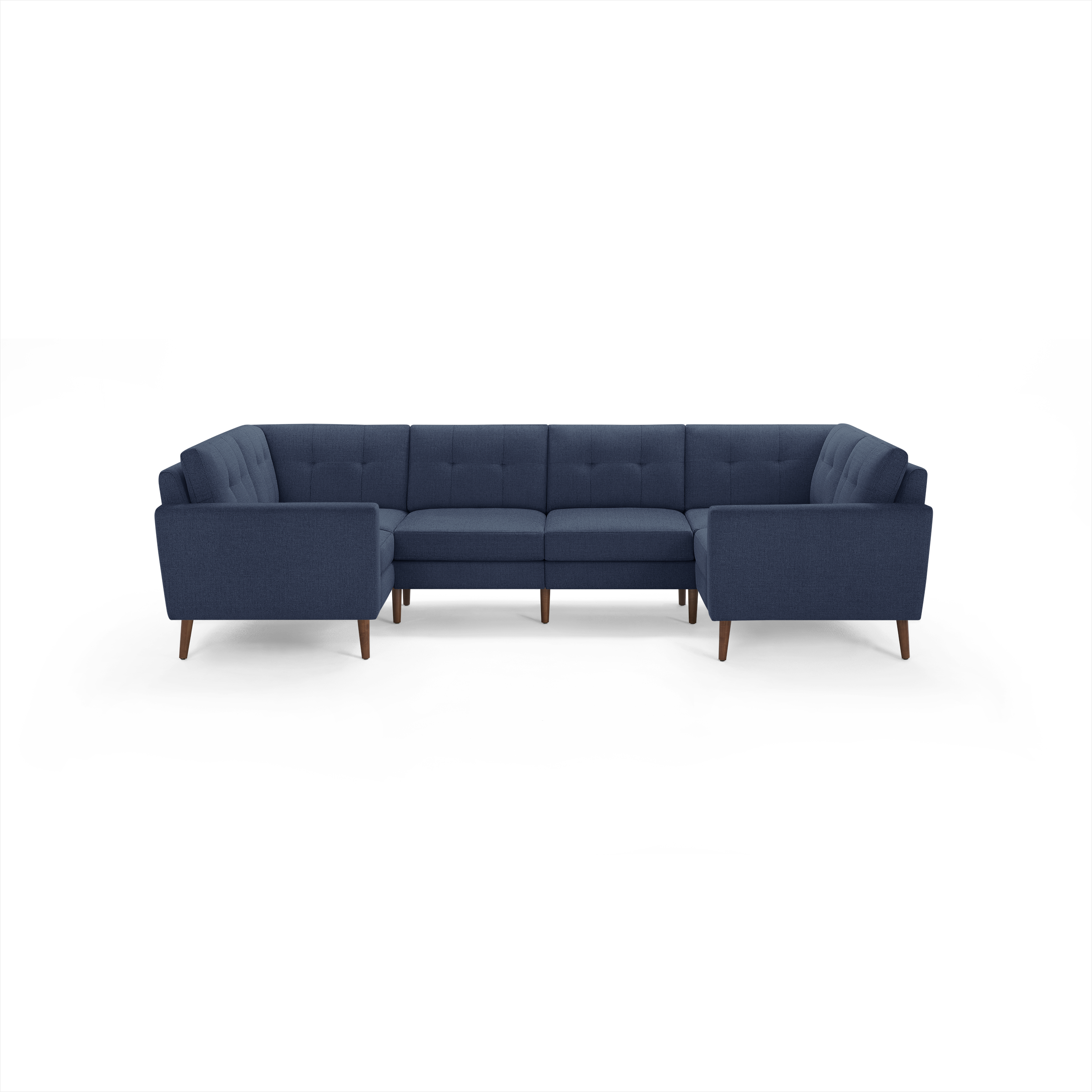 U-shaped sectional sofa in dark blue fabric with tufted cushions, wooden legs, and clean, modern design.