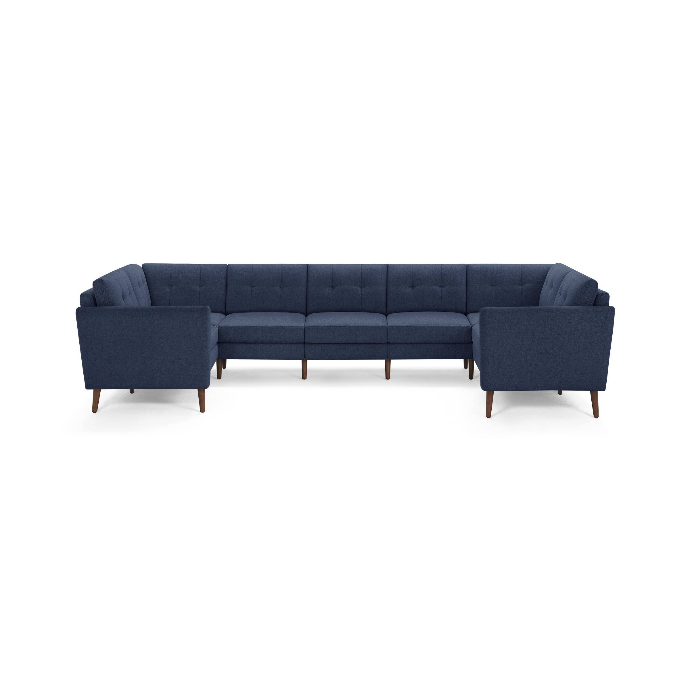 Large modern U-shaped sectional sofa with deep blue fabric upholstery and wooden legs, featuring tufted back cushions.