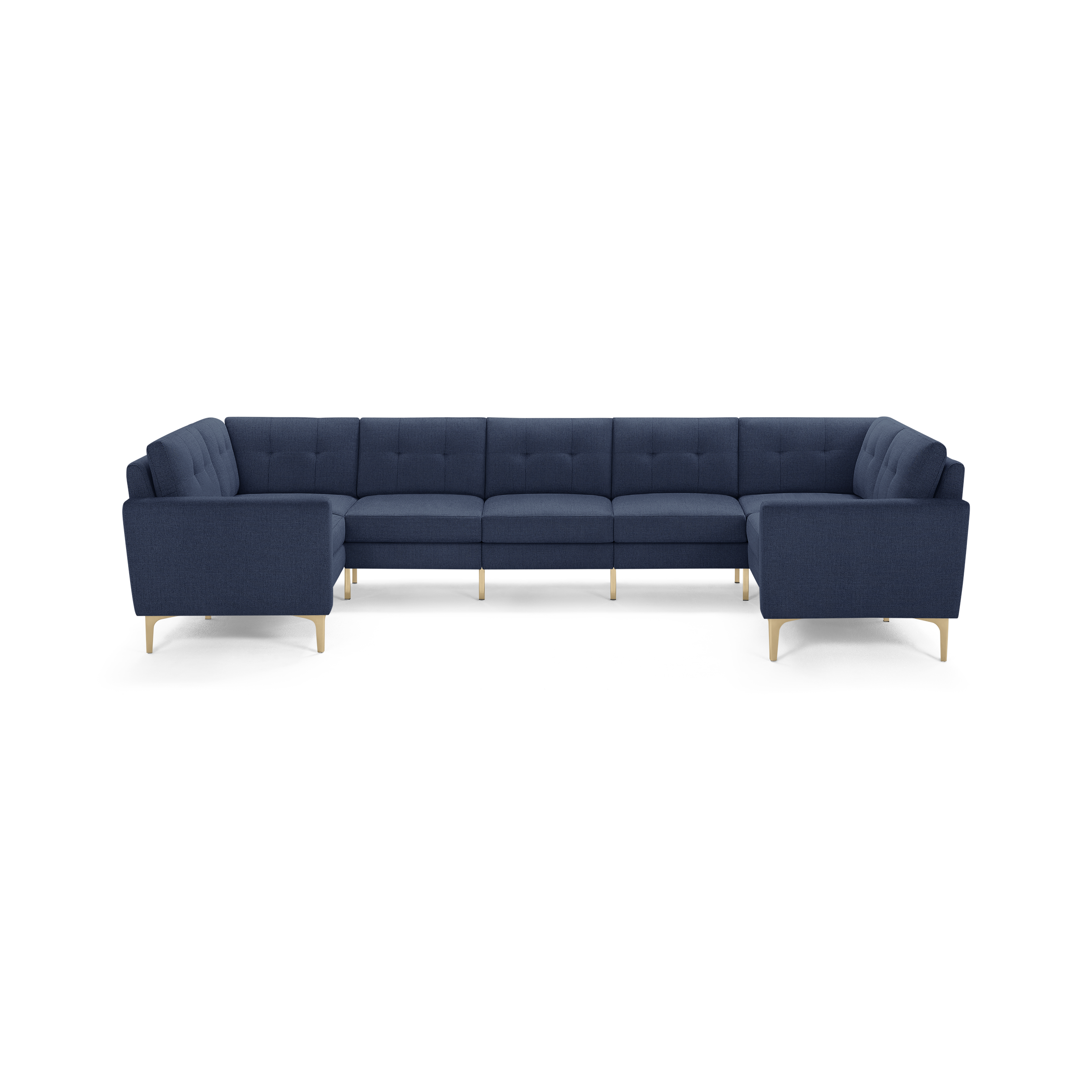 Large navy blue sectional sofa with tufted back cushions, clean lines, and light wooden legs.